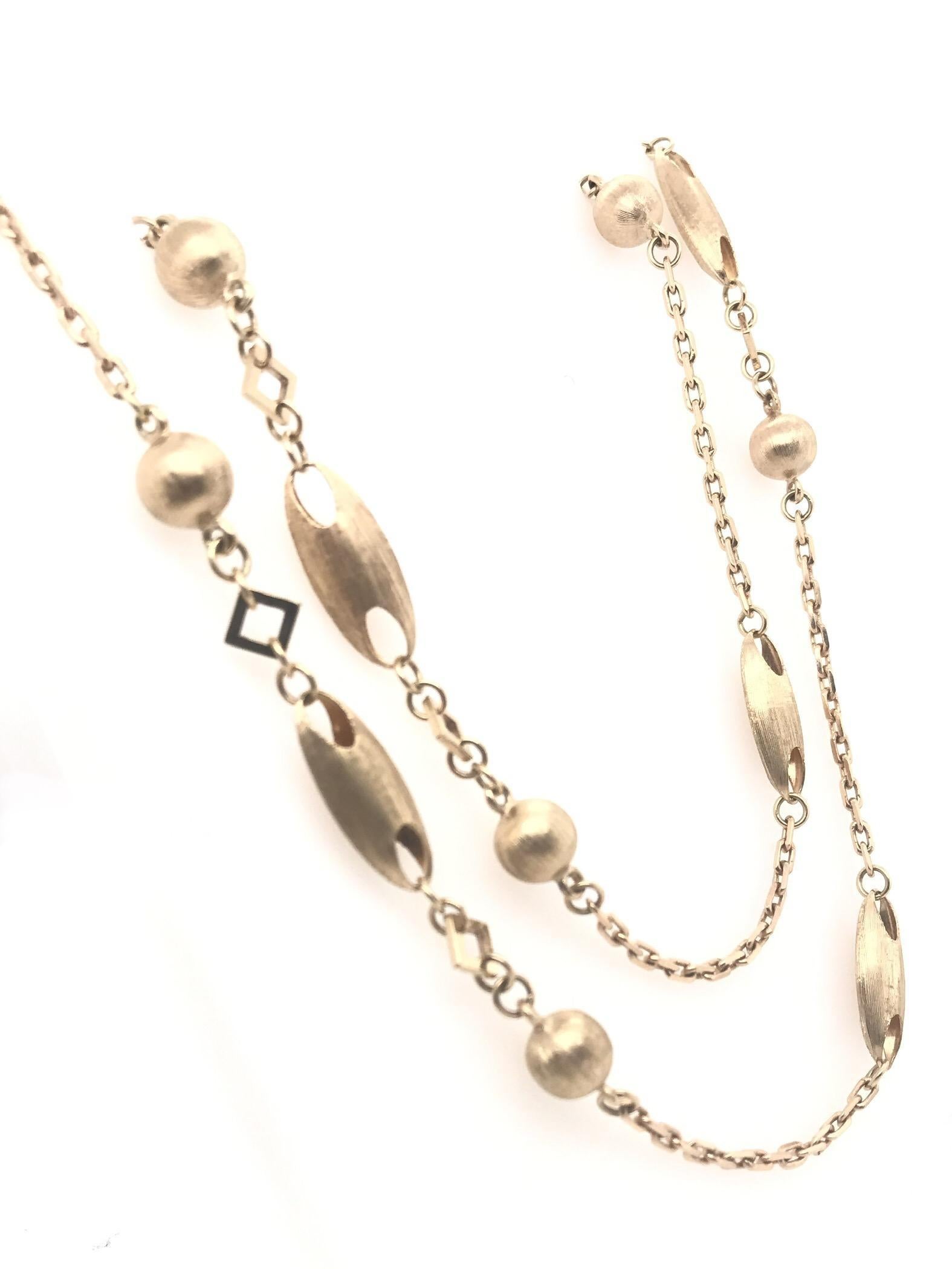 This contemporary estate piece is the perfect addition to your everyday jewelry collection. Layer it with your gold or platinum pieces for a more curated style. This 14K gold necklace measures approximately 27 inches in length and features