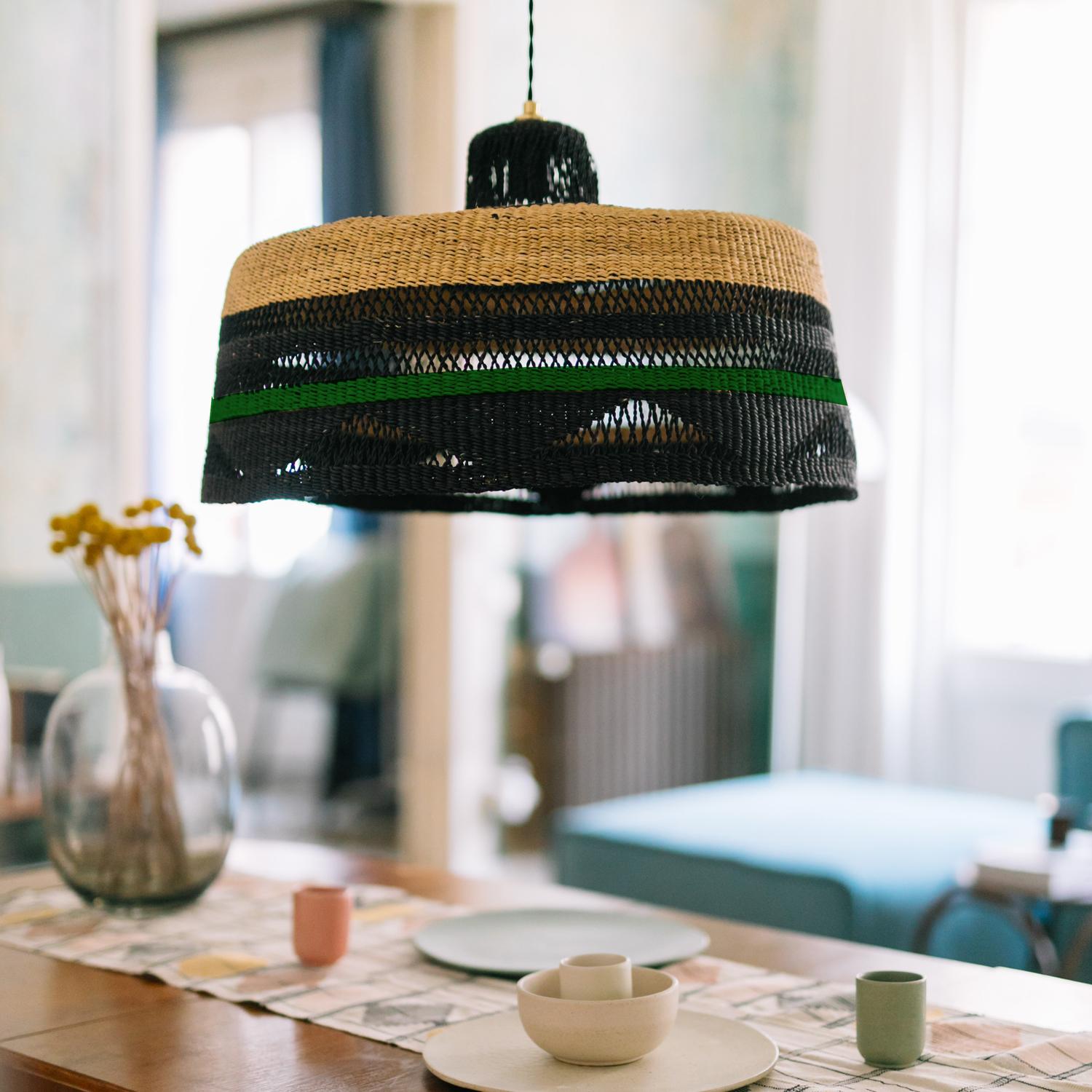 Large Woven Pendant Lamp SHADOW : 
A colourful show-stopper
Colour: Herb (bottle green) / Violet

Do you love decorative motifs and exciting colours? We can create panache in your home with our large pendant lamp with it’s open weave woven like lace
