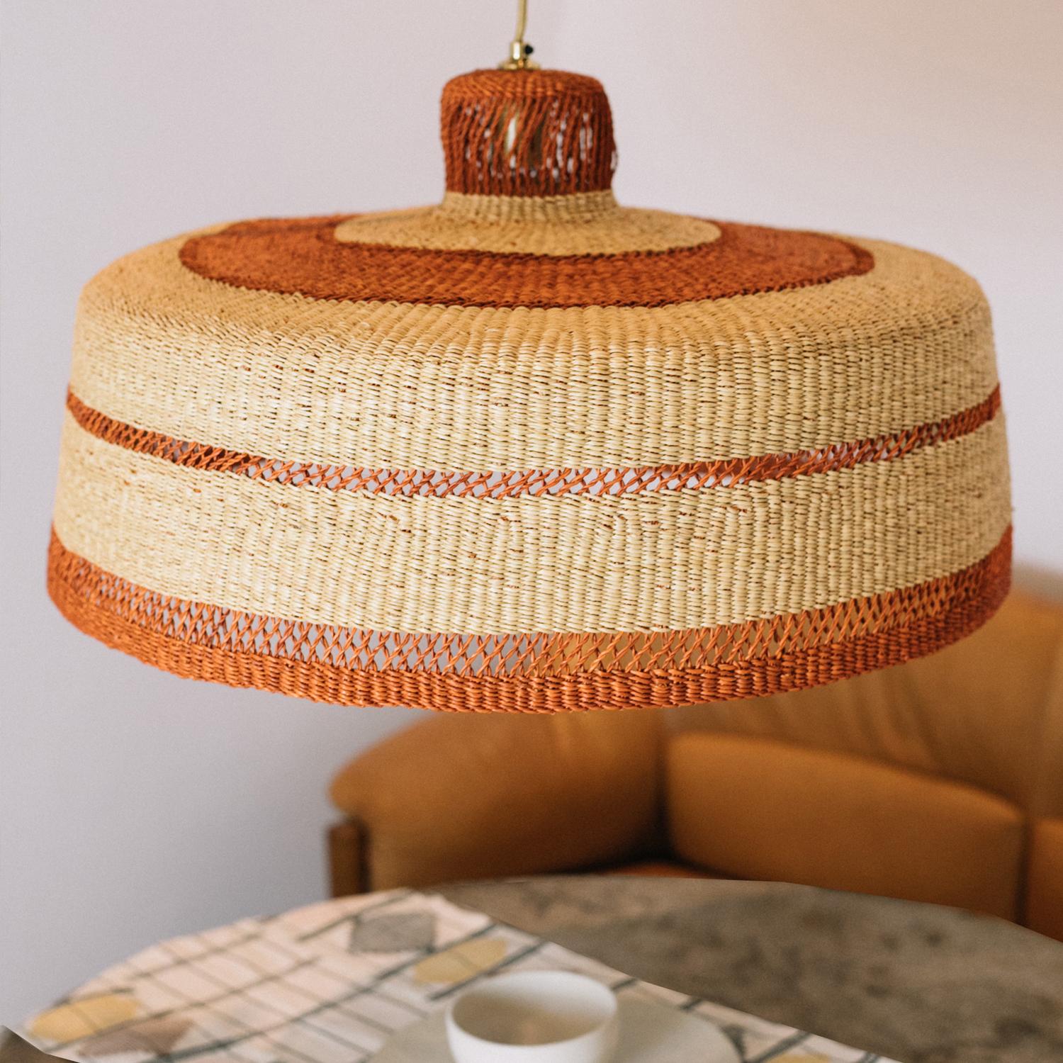 Large woven pendant lamp DEEPLY XL: 
Naturally elegant
Colour: Natural and ginger (terracotta)

Characteristics: 
The lamp is sold ready to hang with : 
*1.9 meters of cloth covered cable, colour Gold; 
*Gold lamp holder ; 
*Ceiling Rose in brushed