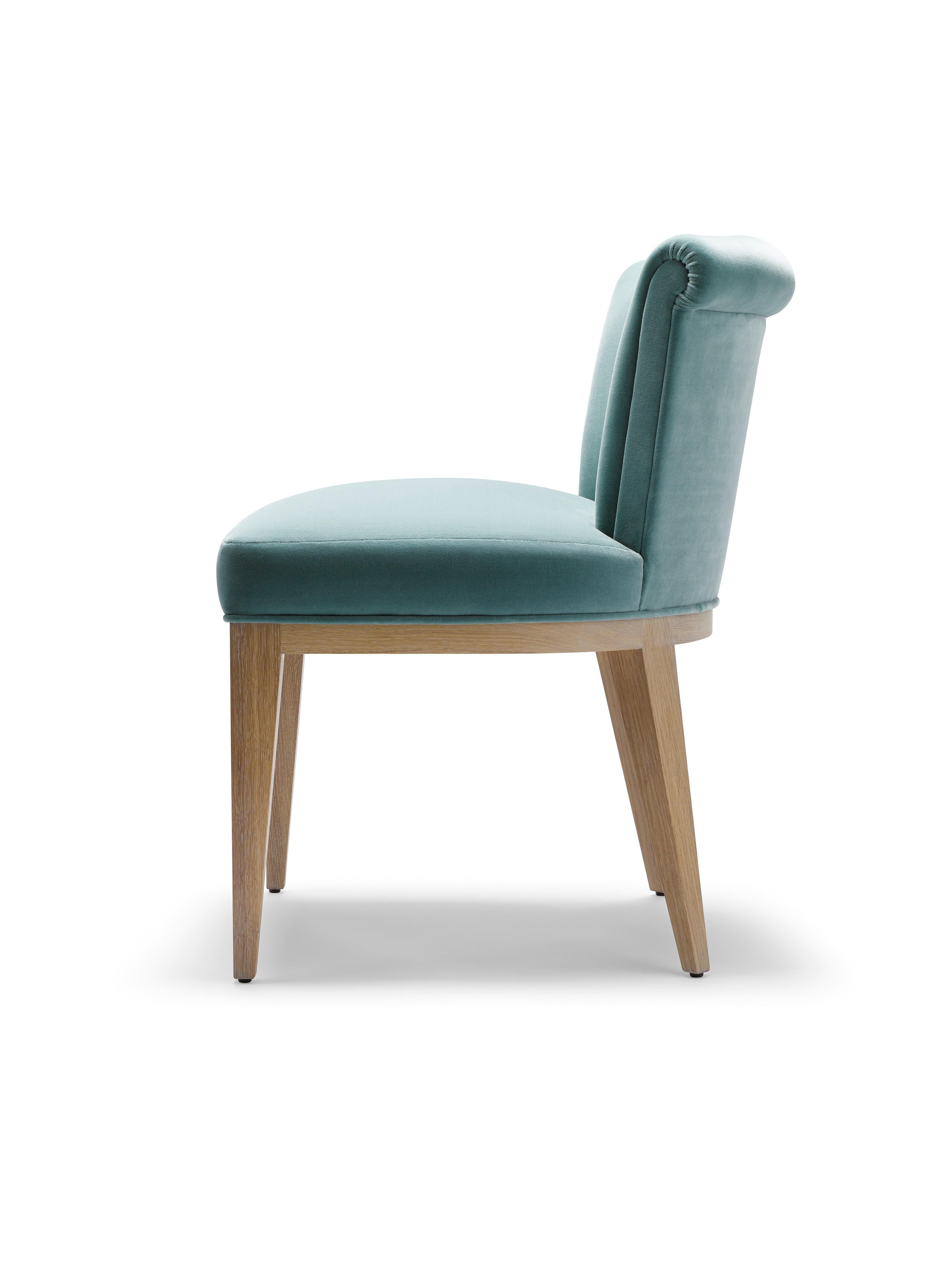 The Eto Dining Chair is a simple, elegant and beautifully detailed dining or occasional chair with a show frame made entirely from solid walnut or oak. 

Shown here upholstered in soft blue cotton velvet, with legs in white oiled oak.

Show frame