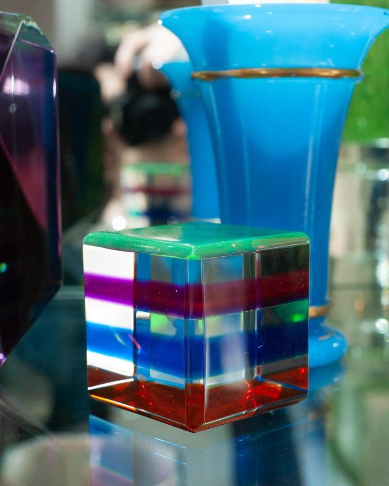 A stunning contemporary multicoloured acrylic block. A perfect riser for a small sculpture or a statement on its own on the table or desk, this beautiful block will reveal different tones and hues of colour from each angle it’s viewed from.