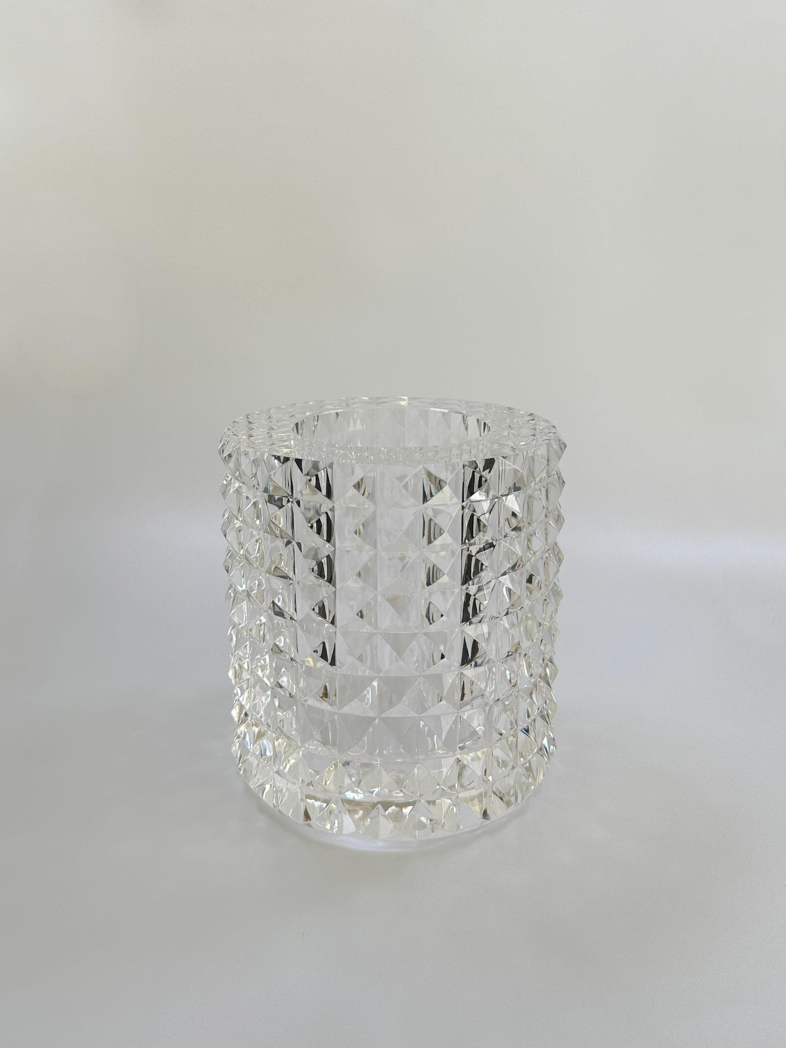 Contemporary faceted optical glass vase by Veritas, Texas, 2016, in crystal-clear cut glass with pyramid facets and a sculptural modern form. This thick, heavyweight optical glass vase is hand-crafted from premium glass, precision-cut with rows of