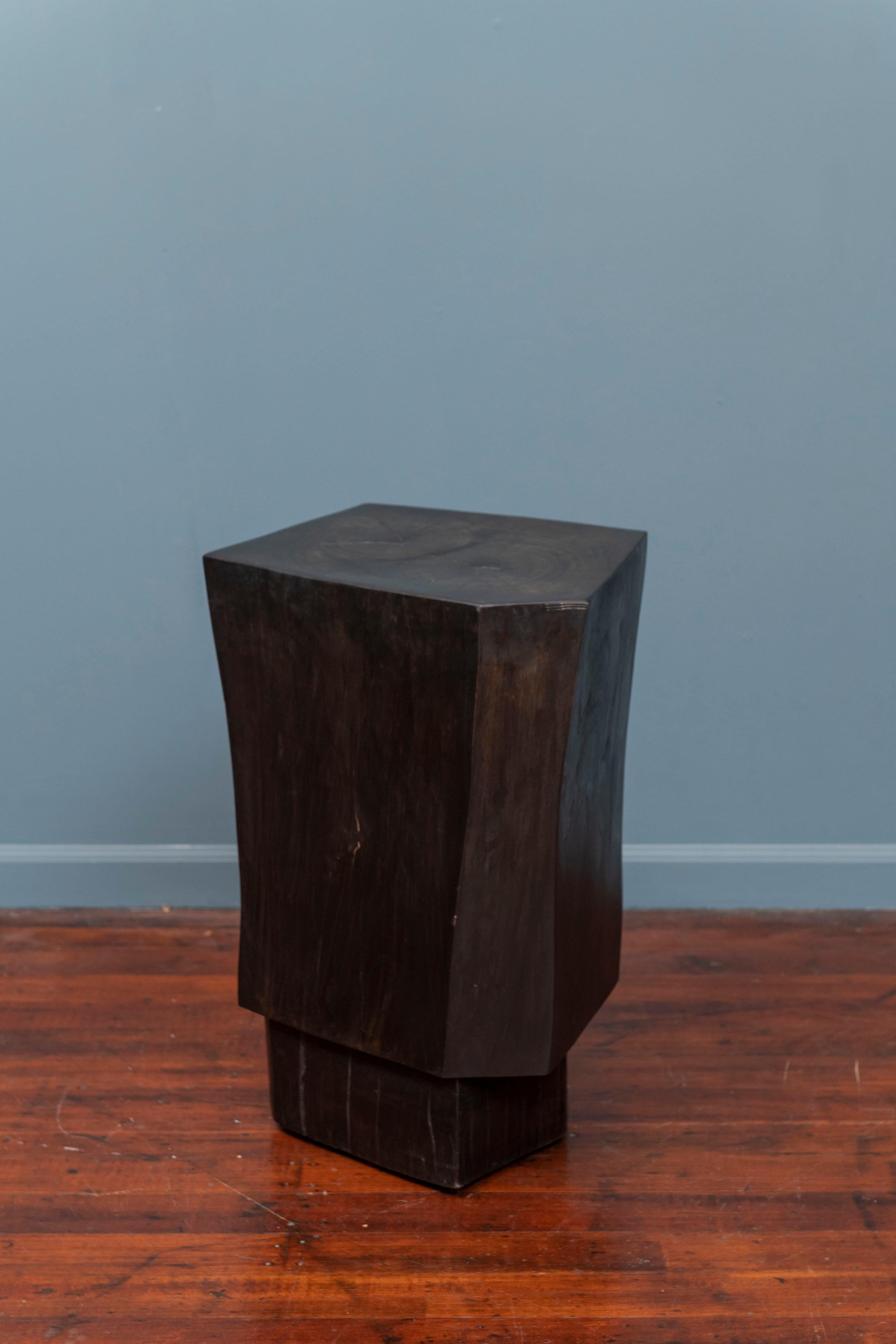 Contemporary faceted and ebonized side or pedestal table.
