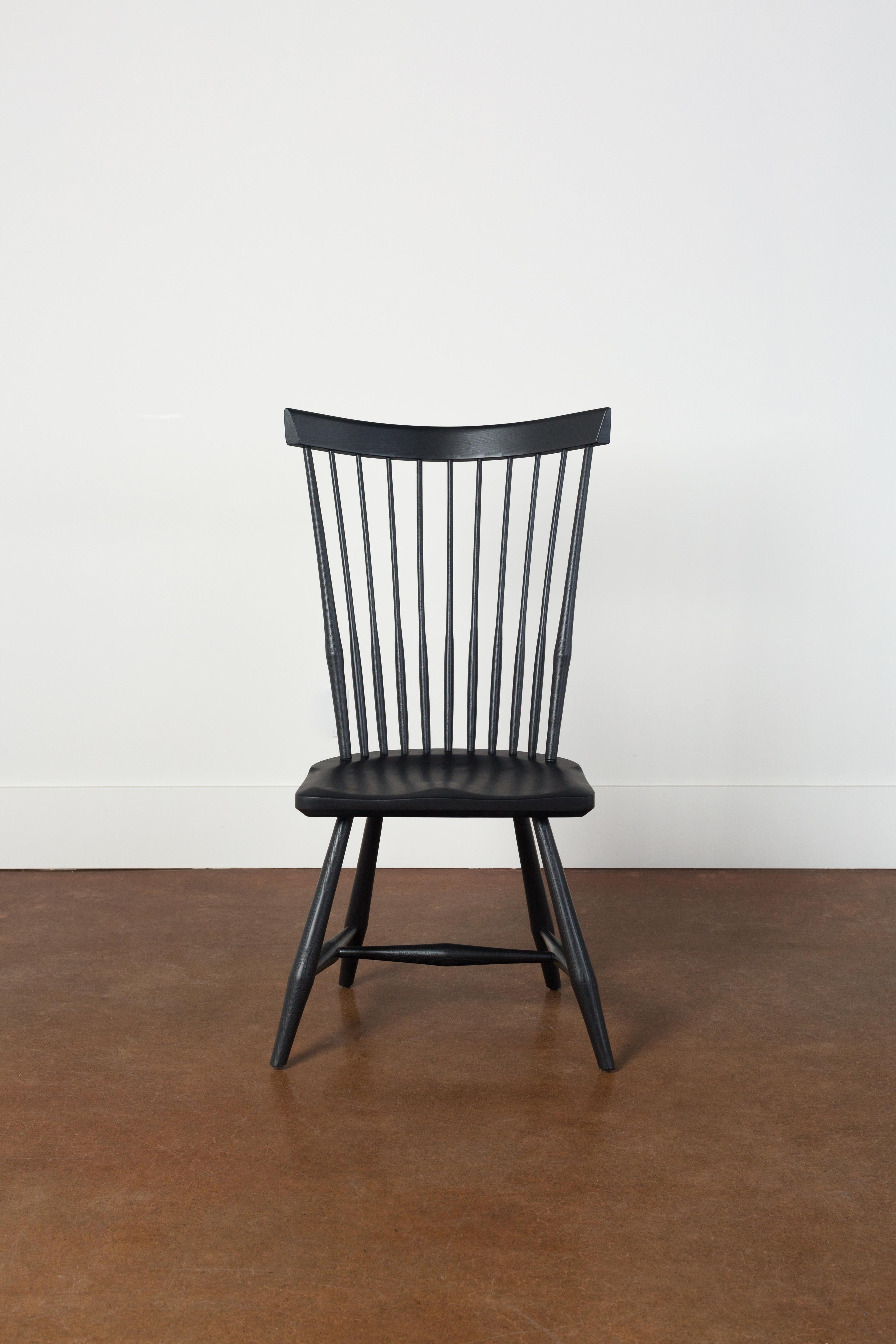 Our contemporary Windsor fan back side chair infuses a modern touch into a timeless design.

Inspired by the classic fan back Windsor chair, our contemporary design preserves the iconic fan-shaped backrest with spindles and gracefully curved top