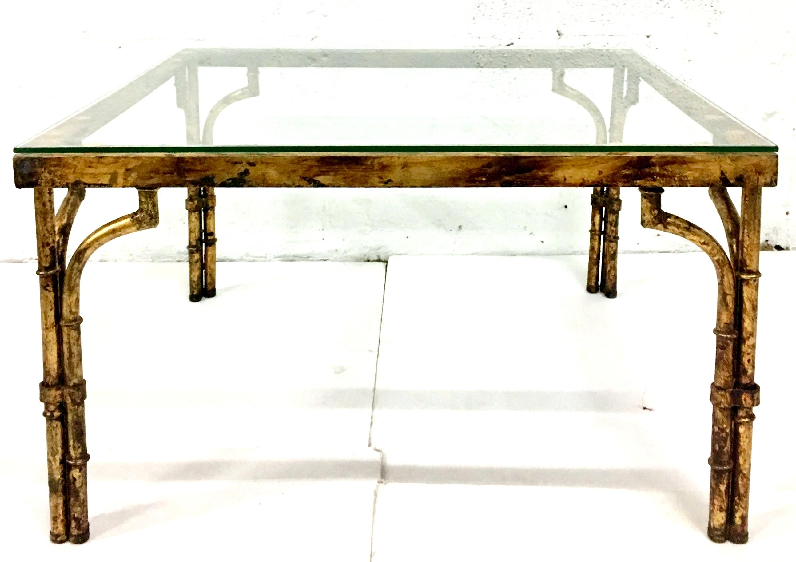 21st Century Contemporary & New faux bamboo aged gilt gold iron glass top coffee table.
Glass top is .25