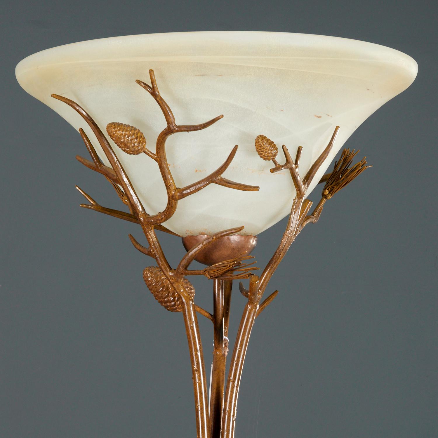 Late 20th c., an attractive torchiere style floor lamp with patinated metal branch and leaf design with glass dome shade, unmarked. The glass shade is held up by depictions of fir pine cones and needles rendered in metal.  

Dimensions:
71.75