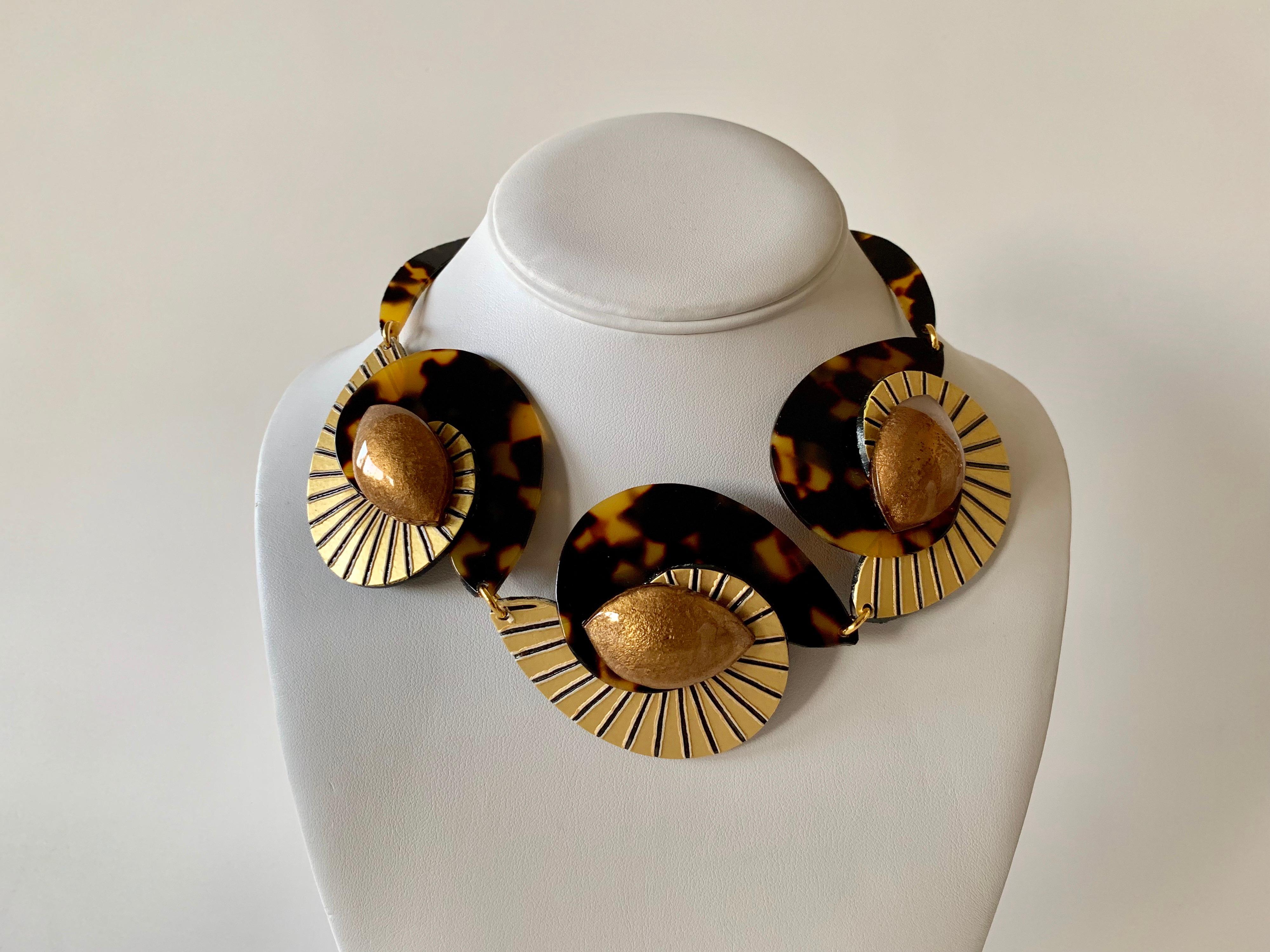 Contemporary faux tortoise gold architectural statement necklace handcrafted in Paris France by Cilea. The statement necklace features architectural enameline (enamel and resin composite) panels in black, gold and tortoise.  A unique well-crafted