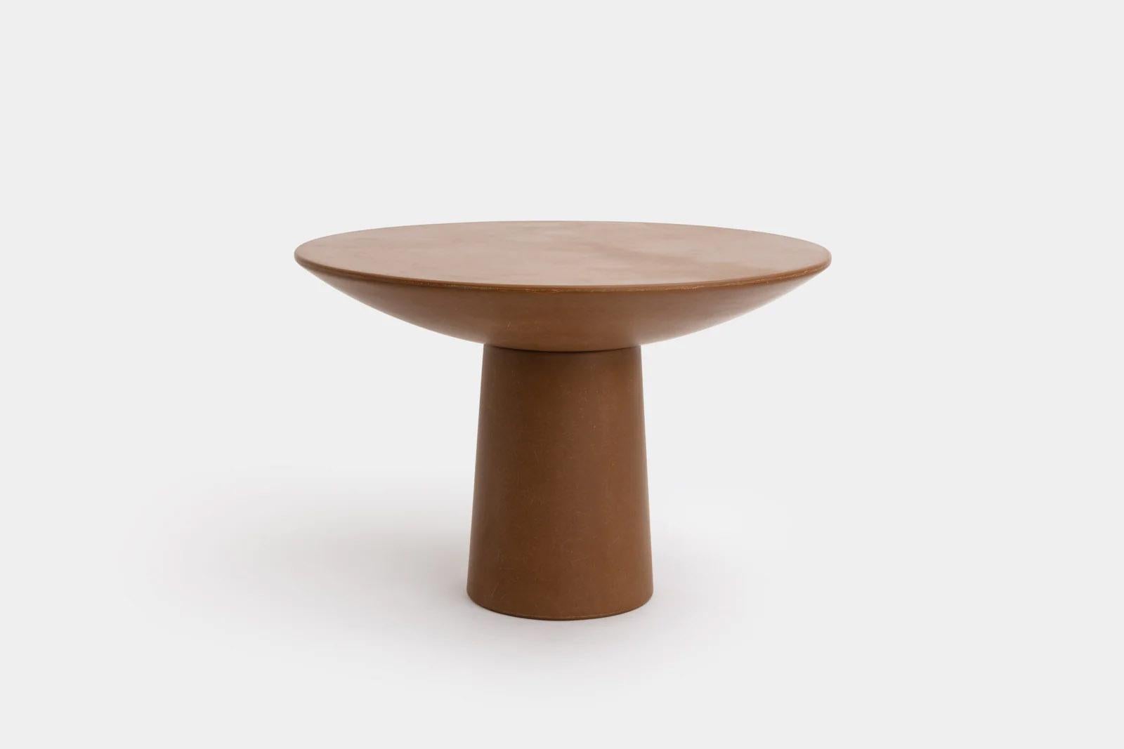 Contemporary fiberglass dining table - Roly Poly small dining table by Faye Toogood. This is shown in the chestnut fiberglass finish. 
Design: Faye Toogood
Material: Fiberglass.  
Available also in Chestnut Raw, Raw,
Charcoal, Charcoal Raw,