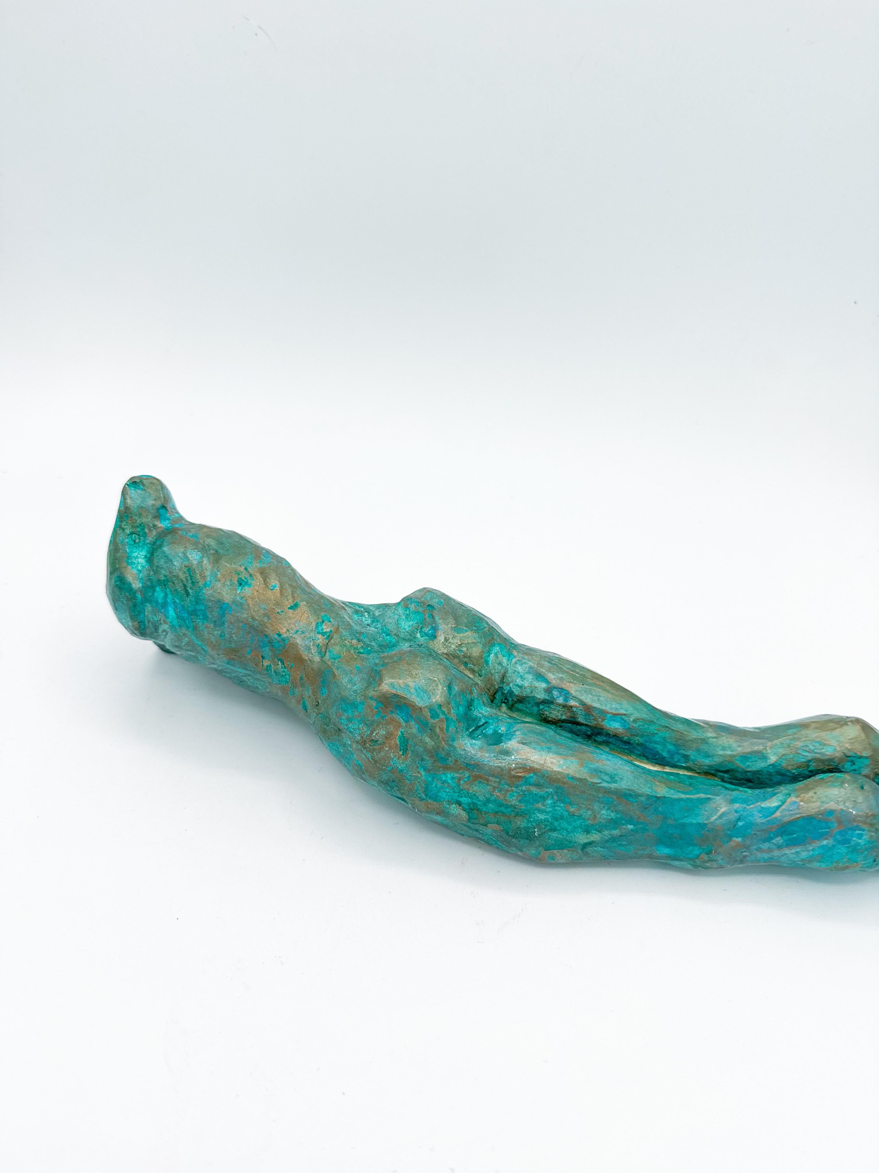 This contemporary figurative wall-mounted sculpture by artist Animism beautifully merges art and function. Featuring a stylized male torso with strong anatomical details, the piece also serves as a sculptural wall vase—perfect for holding a single