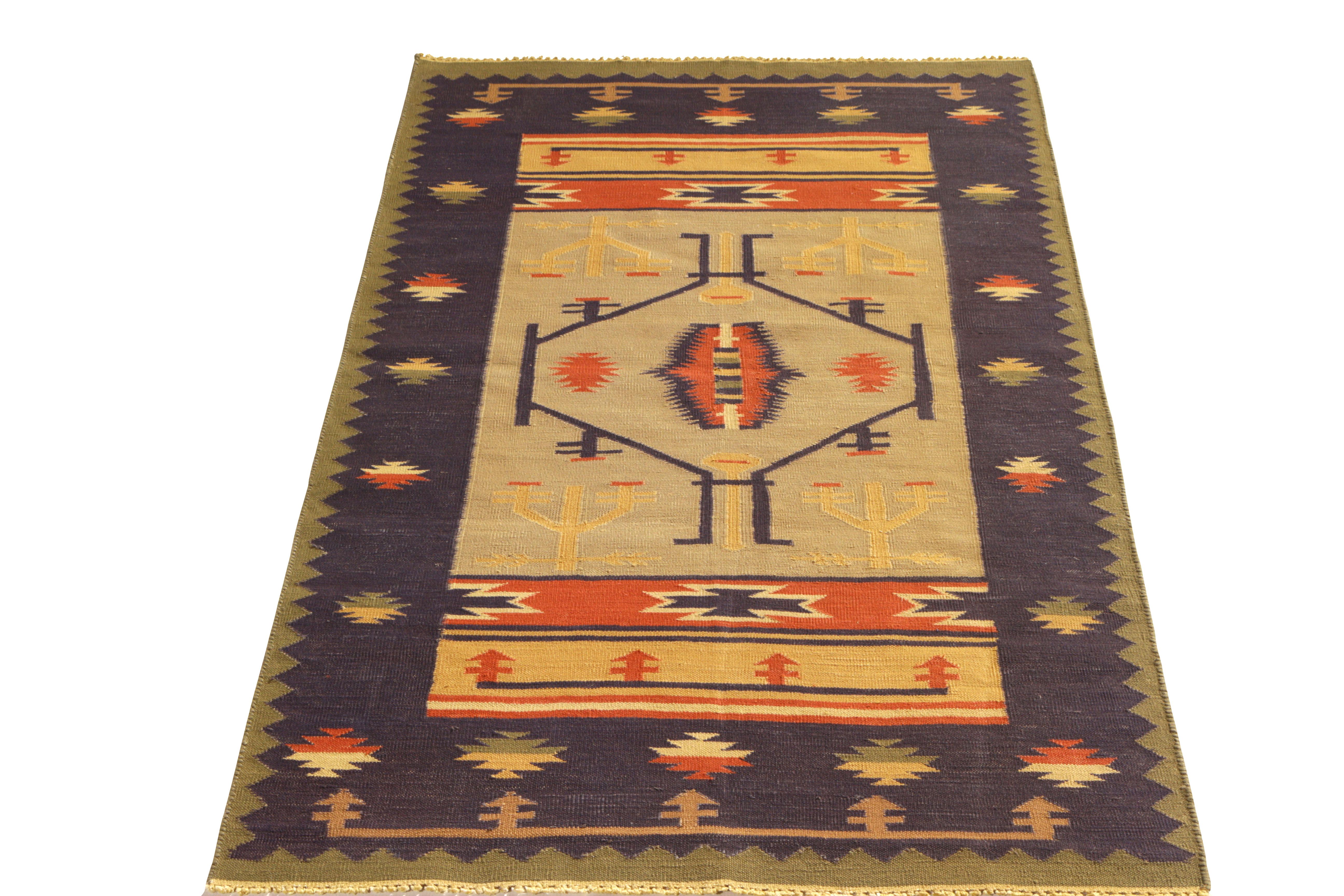 This handwoven cotton flat-weave rug enjoys a complementary play of tribal blue, gold, and red hues in a versatile 3 x 5 size. A welcome addition to the Kilim & flat-weave collection by Rug & Kilim. Ideal for small-size spaces and those seeking