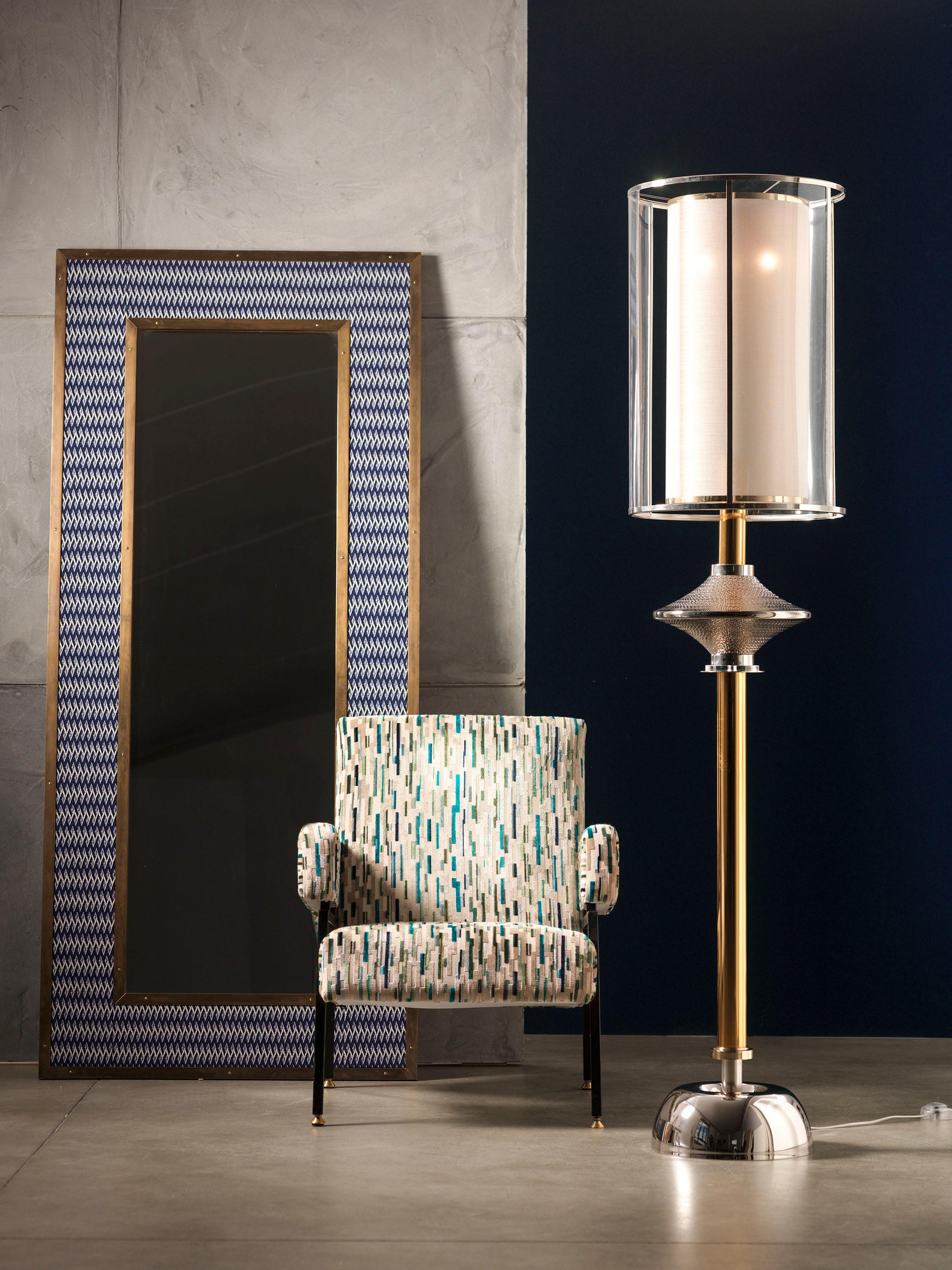 Standing lamp in golden and nickel brass with central part in Majolica engraved and platinum-plated. The nickel brass lampshade is composed by Plexiglas; the internal lampshade is in gold laminate fabric.