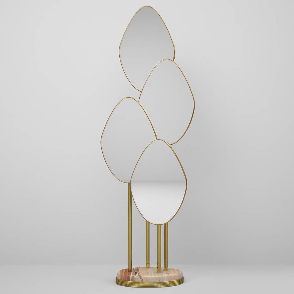 Art deco inspired floor mirror featuring series of polished brass tubes and four leaf shaped overlapping mirrors. 
The base in Travertino marble. 
Other metal and marble finishes available upon request.
Dimesnions:
H: 182 cm 71.6’’ W: 46 cm 18.1’’