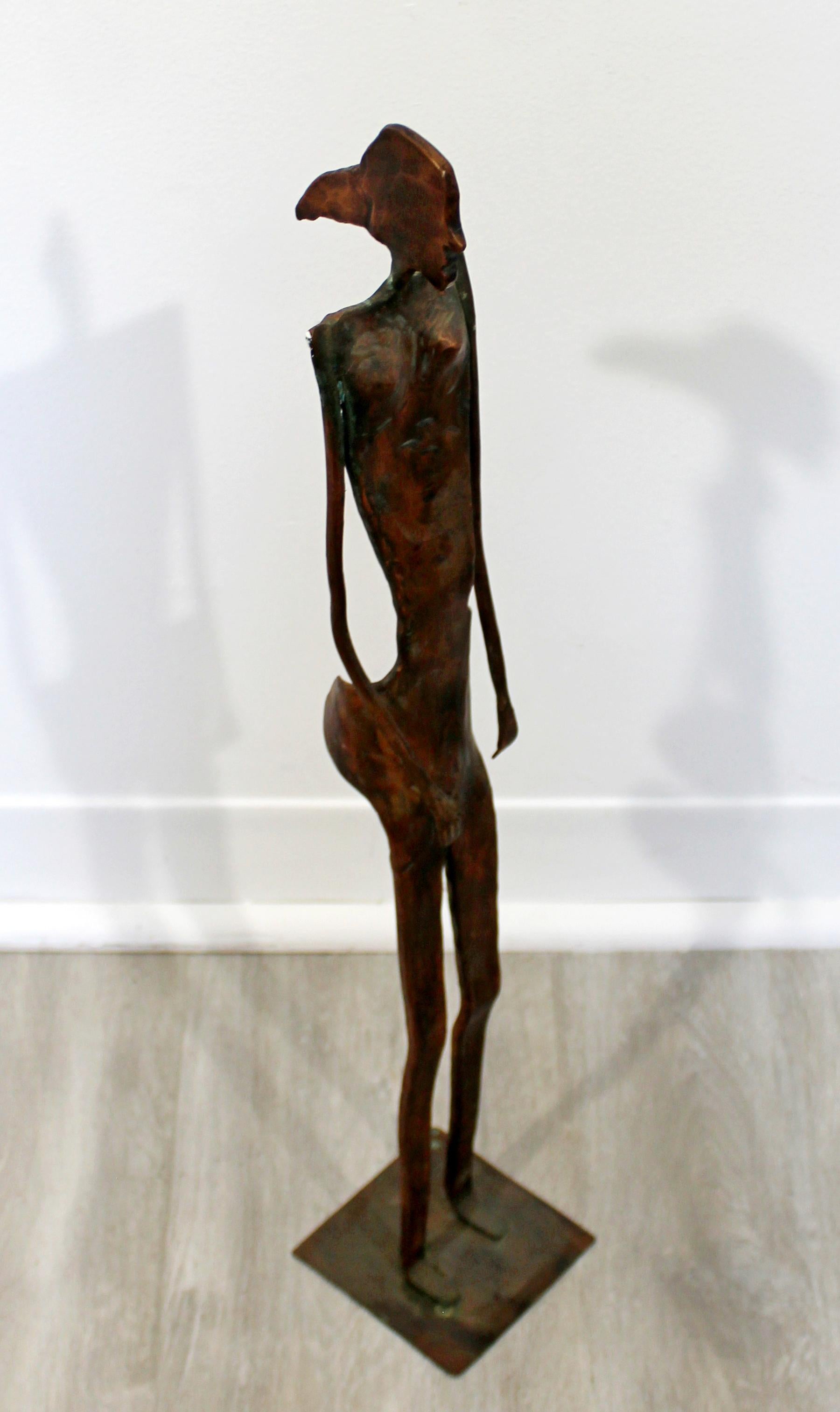 For your consideration is a stunning, forged copper metal table sculpture of a nude woman, signed by Robert D. Hansen, dated 2001. Reminiscent of Giacometti. In excellent condition. The dimensions are 4
