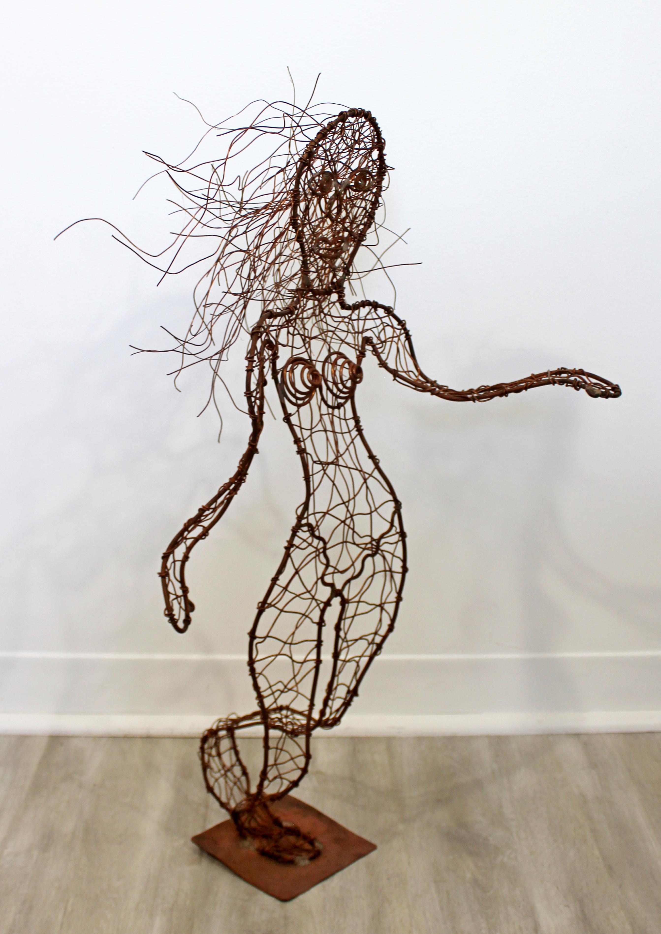 For your consideration is a whimsical, forged copper metal wire sculpture of a nude woman, by Robert D. Hansen. In excellent condition. The dimensions are 13