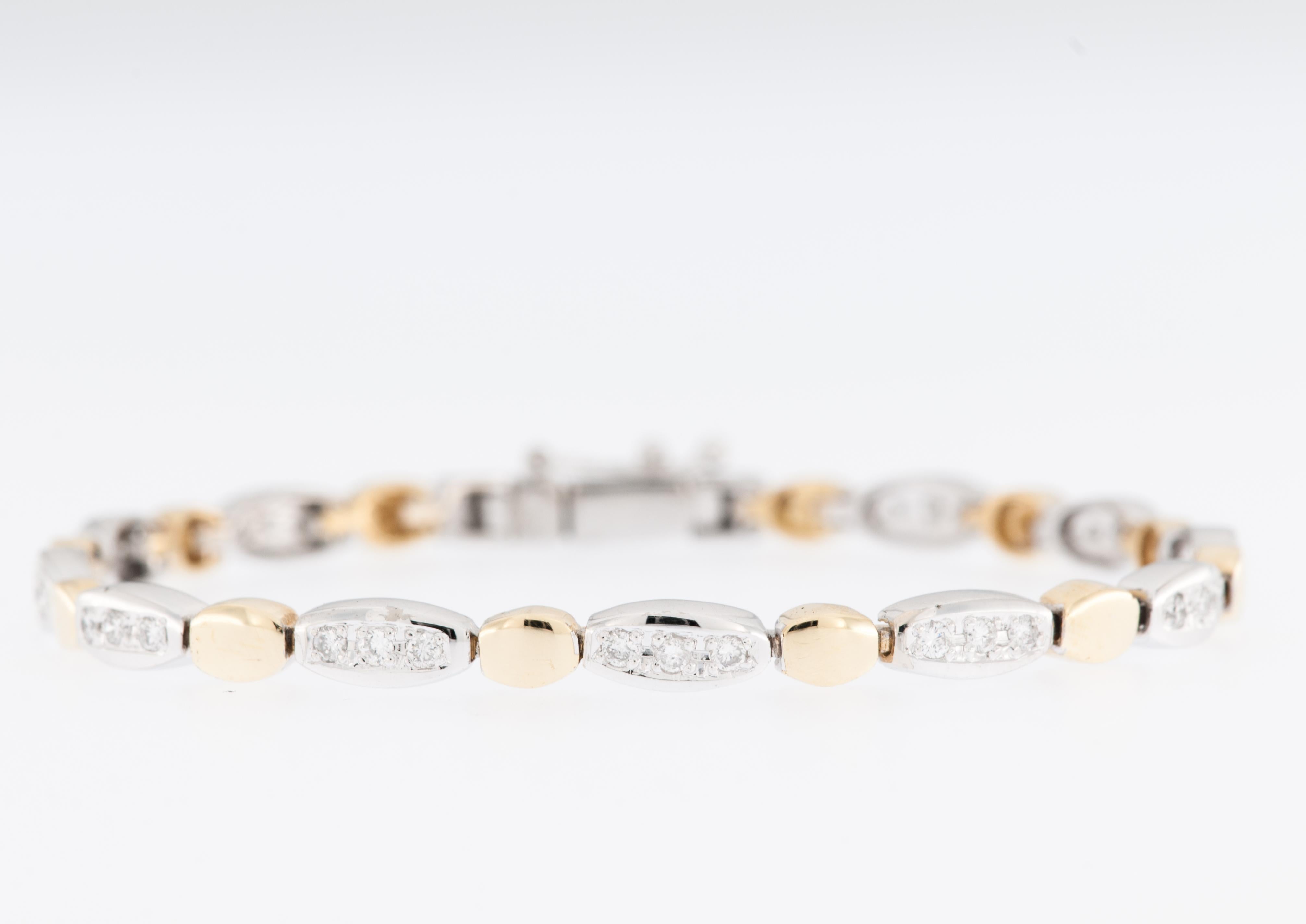This contemporary French bracelet is a stunning expression of modern luxury, crafted with meticulous attention to detail and a harmonious blend of 18 karat yellow gold and white gold. The combination of these two precious metals gives the bracelet a