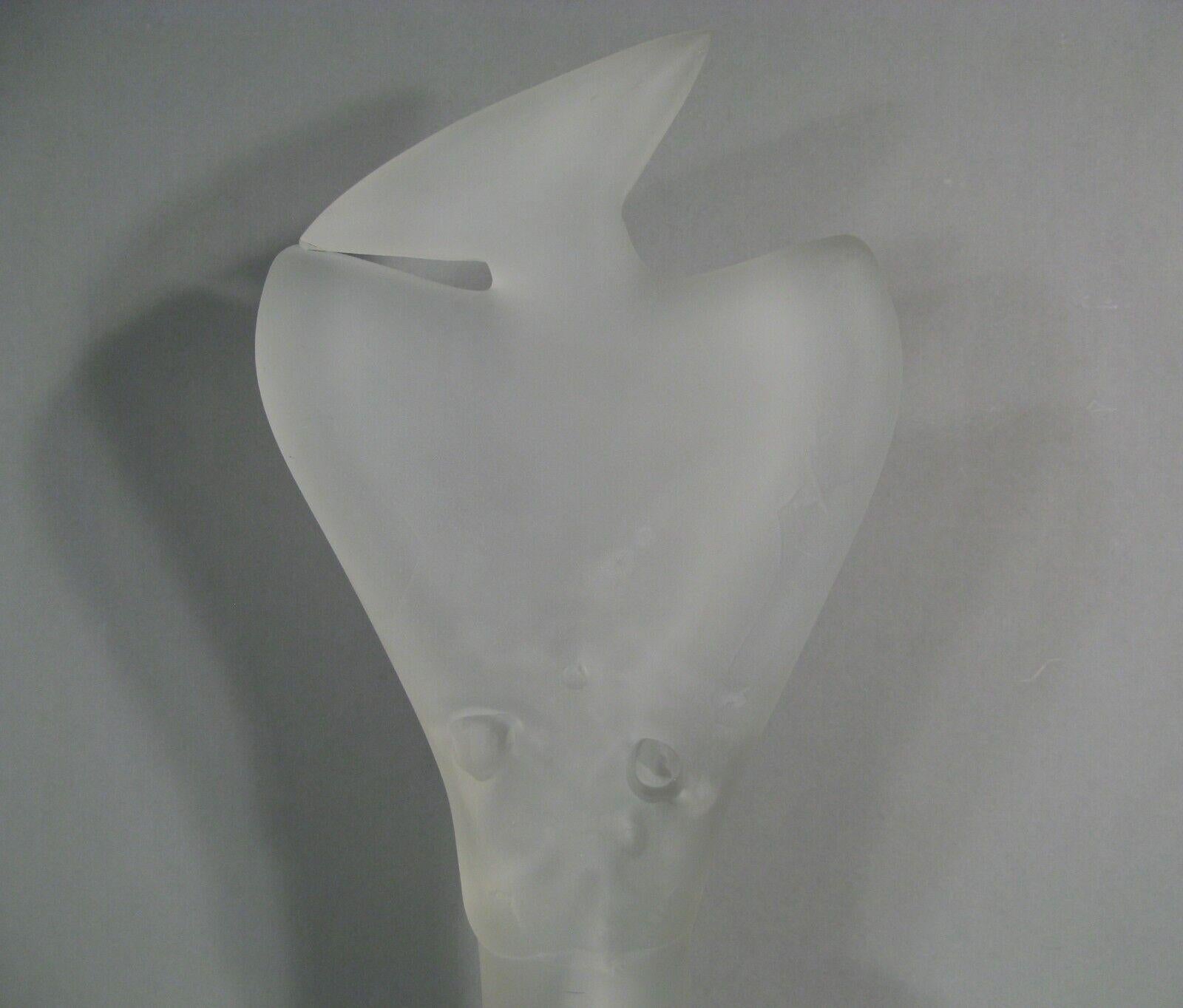 A contemporary frosted glass sculpture symbolizing a stylized woman. Inscribed and dated on the base: 