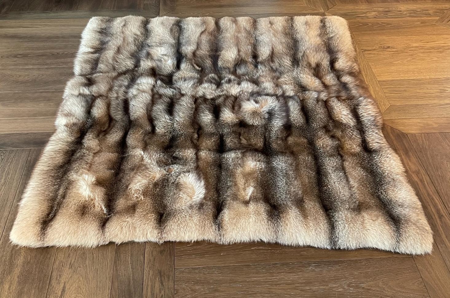 Fox fur throw.

An exquisite example of Haute-Fourriere' craftsmanship the fox fur blanket has been hand made from the finest collection of handpicked crystal fox fur pelts. The blanket has been made with 'full pelts' which gives it the wonderful