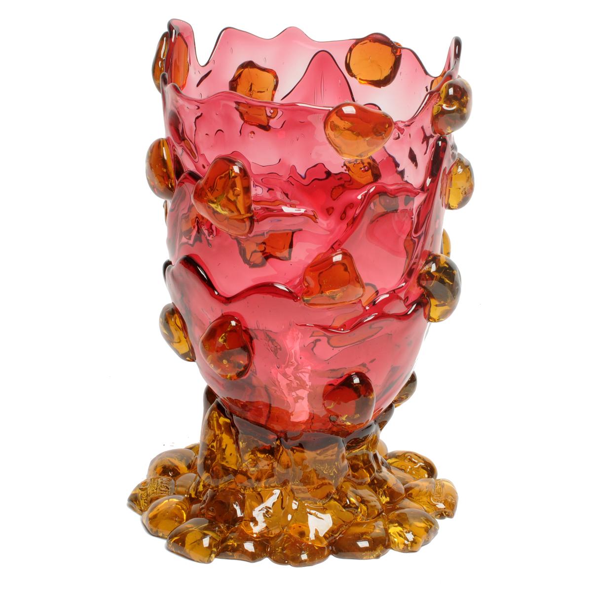 Nugget vase, clear fuchsia, clear yellow.
Vase in soft resin designed by Gaetano Pesce in 1995 for Fish Design collection.

Measures: M - ø 16cm x H 26cm
Colours: clear fuchsia, clear yellow.
Other sizes available.
Vase in soft resin designed