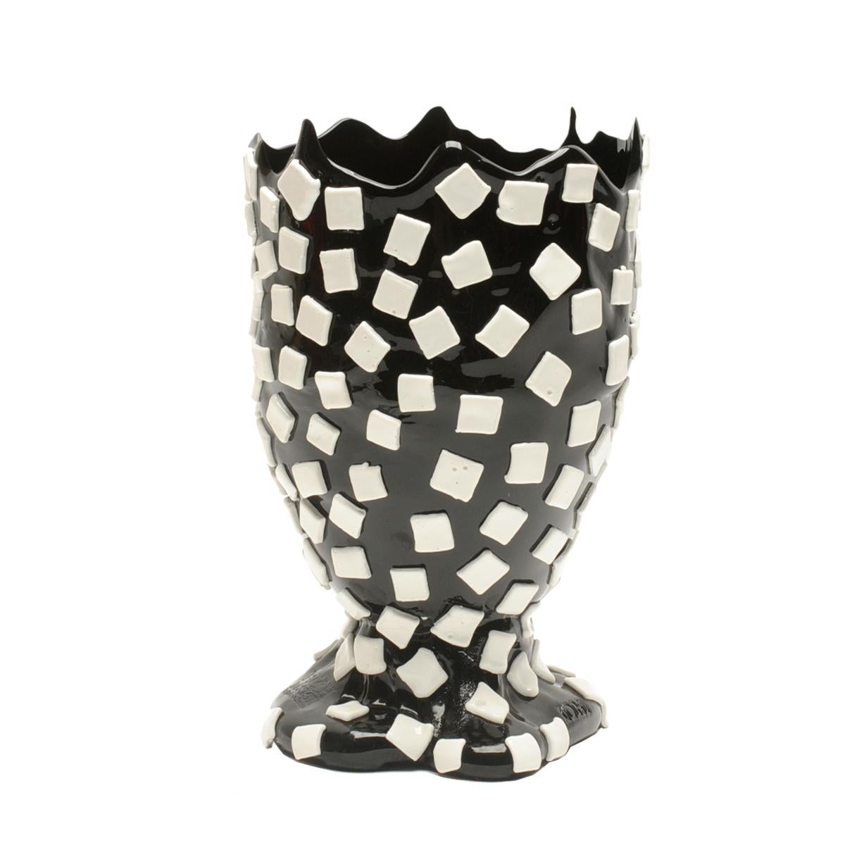 Rock vase - clear antique matt black and white.

Vase in soft resin designed by Gaetano Pesce in 1995 for Fish Design collection.

Measures: M - ø 16cm x H 26cm

Dimensions Available:
S - ø 10.5cm x H 19cm
M - ø 16cm x H 26cm
L - ø 22cm x H