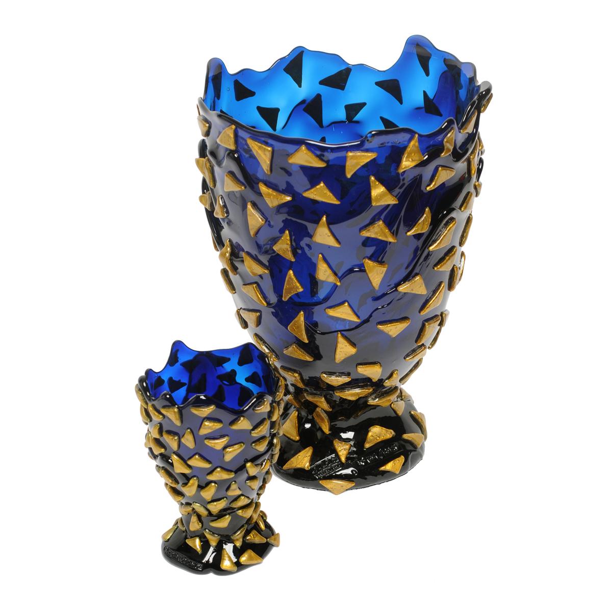 Starry Night vase - Blue and gold.

Vase in soft resin designed by Gaetano Pesce in 1995 for Fish Design collection.

Measures: L - Ø 22cm x H 36cm

Dimensions Available:
S - ø 10.5cm x H 19cm
M - ø 16cm x H 26cm
L - ø 22cm x H 36cm
XL - ø