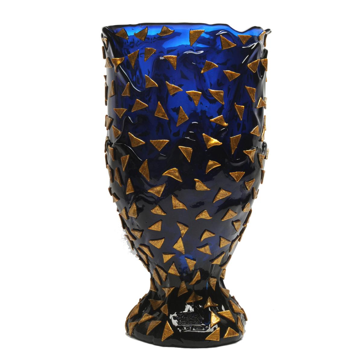 Starry night vase - blue and gold.

Vase in soft resin designed by Gaetano Pesce in 1995 for Fish Design collection.

Measures: XL - ø 30cm x H 56cm

Dimensions Available:
S - ø 10.5cm x H 19cm
M - ø 16cm x H 26cm
L - ø 22cm x H 36cm
XL -