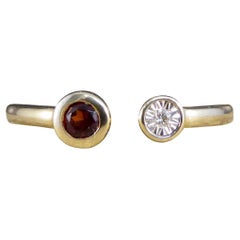 Contemporary Garnet and Diamond Illusion Set Torque Ring in 9ct Yellow Gold