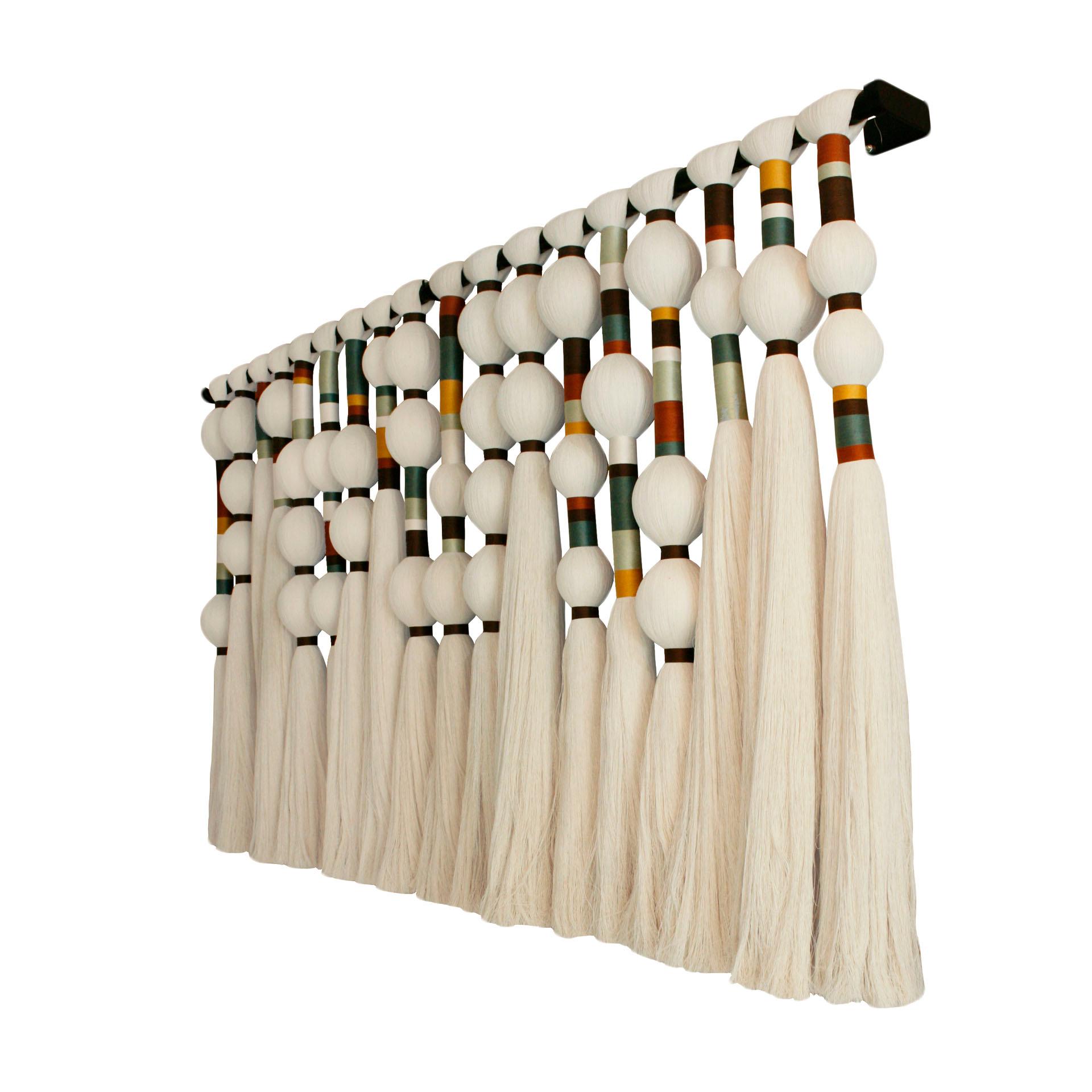 Large format wall-hanging sculpture handmade of 100% raw agave cotton thread. It has naturally dyed thread details in different shades. It is a contemporary reinterpretation of traditional geometric motifs of the indigenous cultures of South