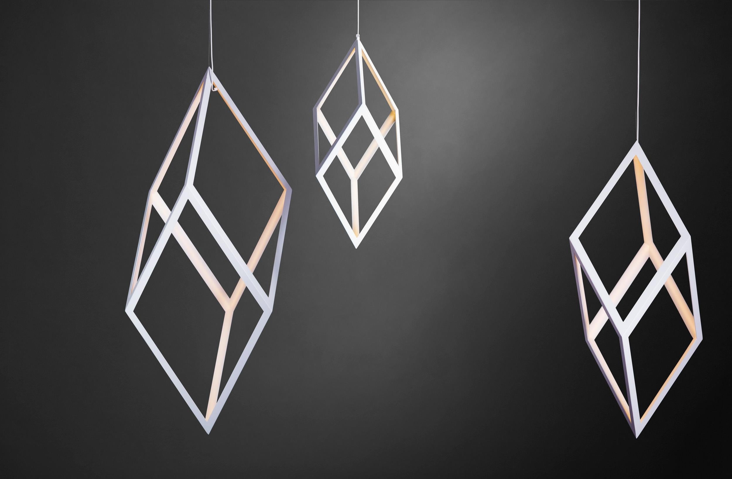 Contemporary Geometric brass or iron light pendant - ORP by Christopher Boots

Oblique Rhombic Prism is a pared-back structure that allows sacred geometry and light to come together as one. ORP emphasises simplicity and form, connecting elements