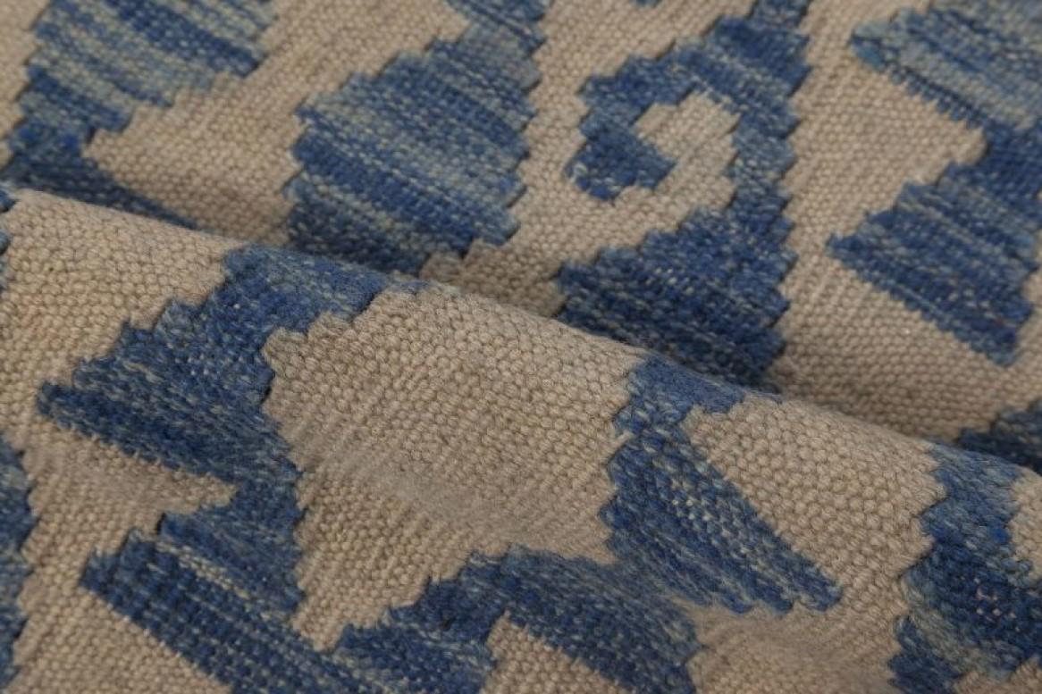 Contemporary geometric blue and beige flat-weave wool rug by Doris Leslie Blau.
Size: 12'10