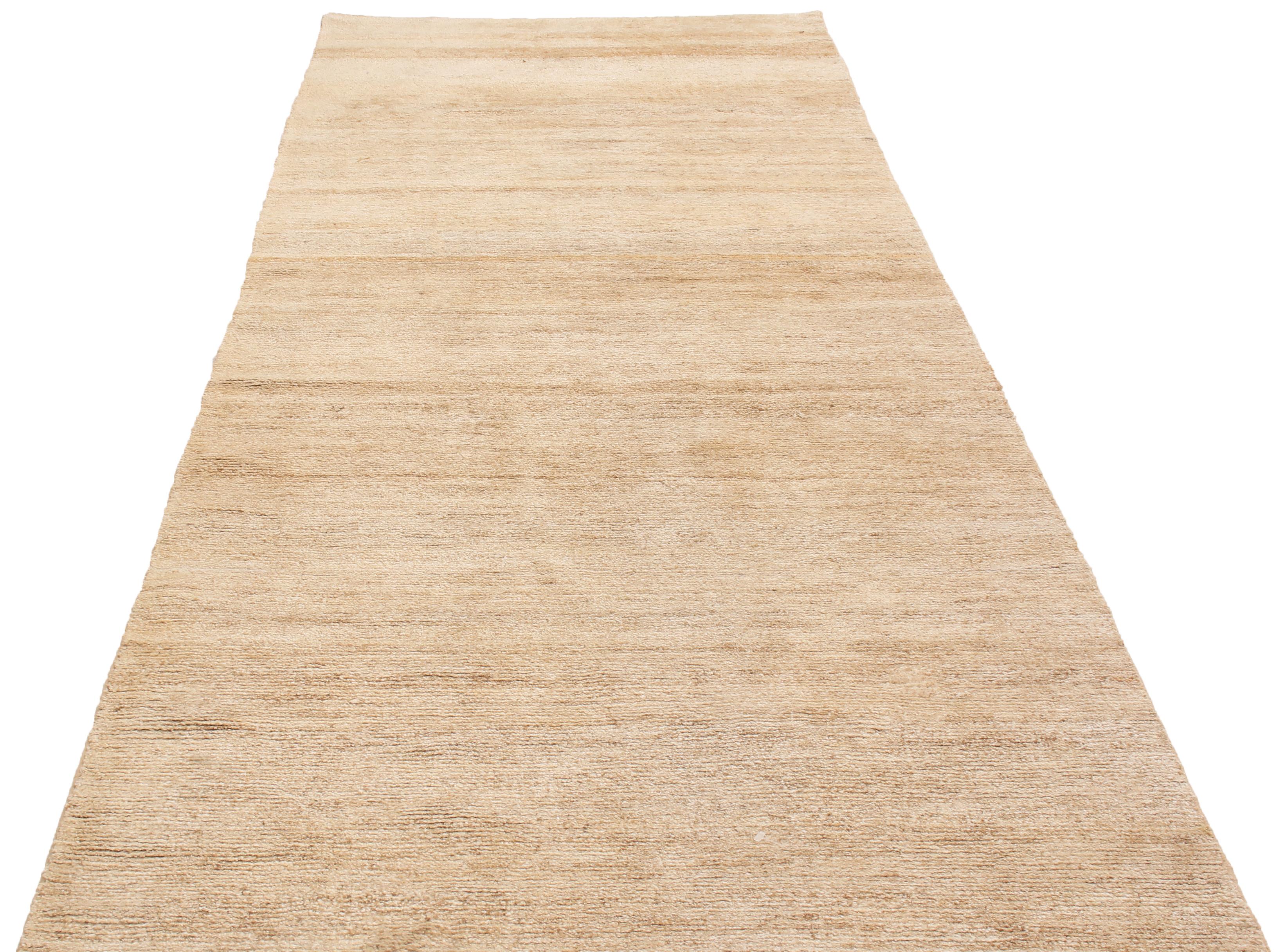 Originating from India, this contemporary high-quality hemp runner sports an inviting horizontal texture complemented by the marriage of muted sky blue and tan beige colorways for a luminous, spacious portrait.