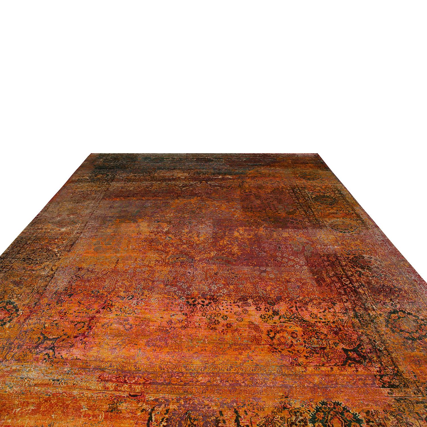 Hand knotted in high-quality luminous silk originating from India this contemporary rug enjoys a unique distressed aesthetic inspired by antique Agra masterpieces, marrying elements of each to achieve this blend of the pomegranate pink-red and gold
