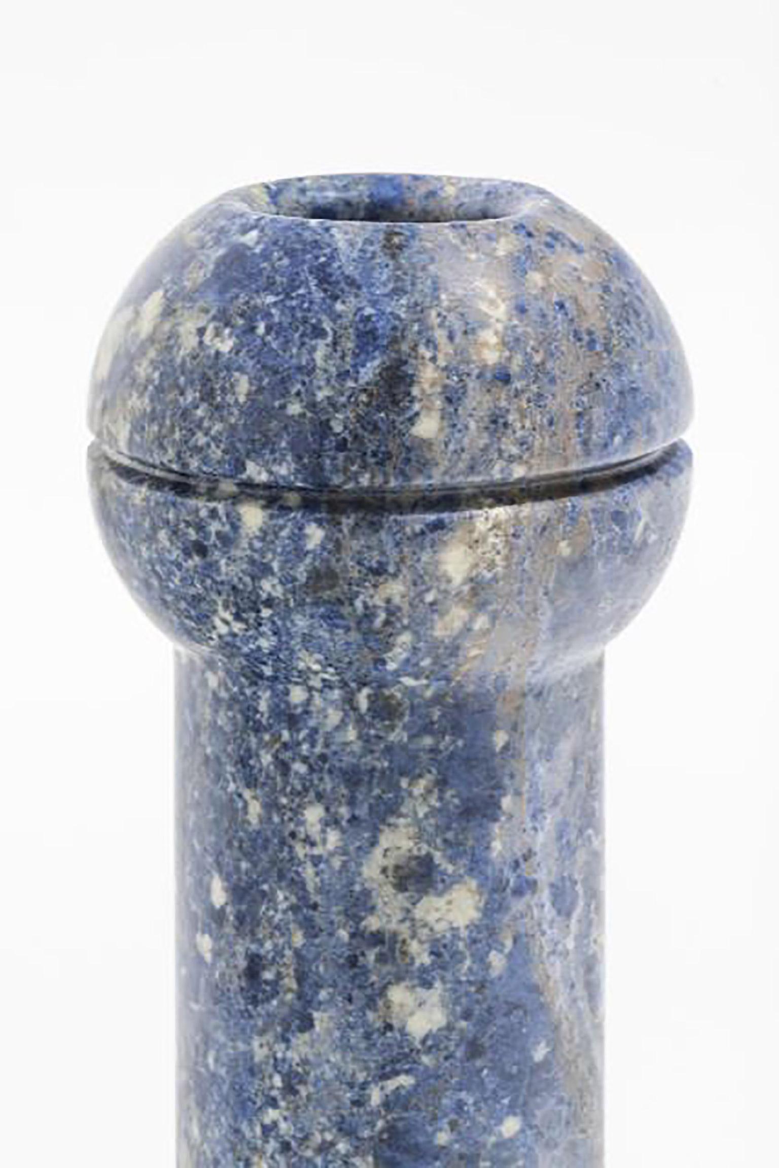 Geometric sculptural vase in Sodalite marble, Simultanea collection. Centripetal, centrifugal, and movement forces are channeled into stone forms, and rotation on the axis become a vase, while an inclined cut suggests a container. Like a mechanical