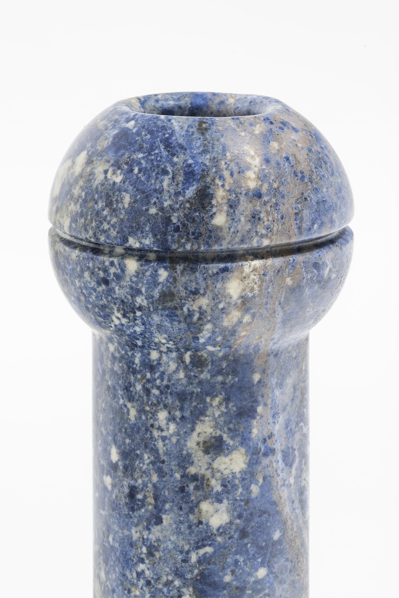 Geometric sculptural vase in Sodalite marble, Simultanea collection. Centripetal, centrifugal and movement forces are channeled into stone forms and a rotation on the axis become a vase, while an inclined cut suggests a container. Like a mechanical
