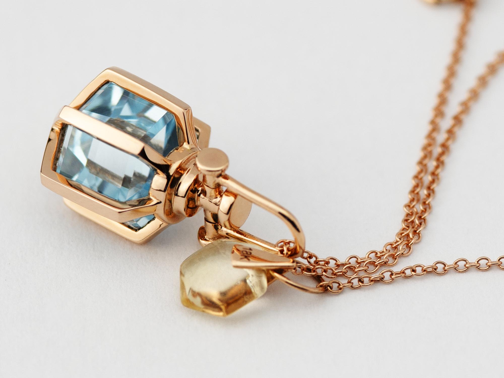 Rebecca Li designs mindfulness.
This elegant dainty necklace is from her signature Six Senses Talisman Collection.

Talisman Pendant :
18k rose gold
Natural healing blue topaz crystal
Pendant size: 10 mm W * 10 mm D * 18 mm H
Blue topaz size:  8 mm