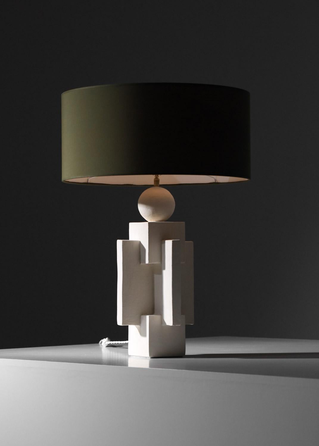 Large contemporary modernist-style table lamp. White plaster base structure with geometric shapes for a highly decorative, sculptural effect. Quality craftsmanship. Quantity on request. E27 LED bulb recommended. 
Dimensions : H. base 46 cm / W. base