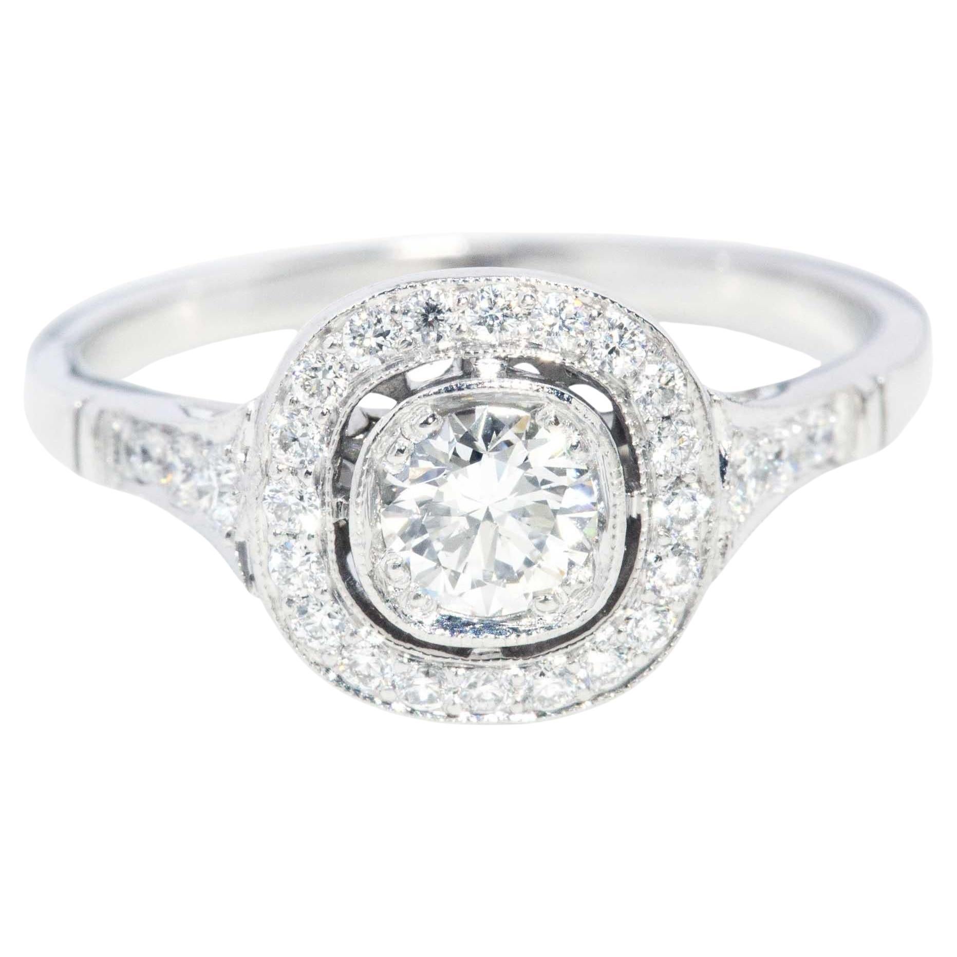 Contemporary GIA Certified Brilliant Diamond Halo Platinum Ring