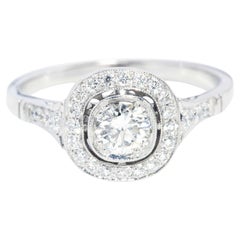 Contemporary GIA Certified Brilliant Diamond Halo Platinum Ring