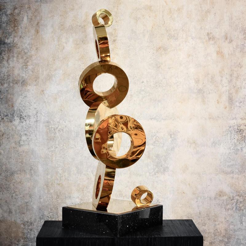 Contemporary gilded metal sculpture, 20th Century.

Modern sculpture in gilded metal, contemporary work from the 20th century.    
h: 108cm , w: 35cm, d: 35cm