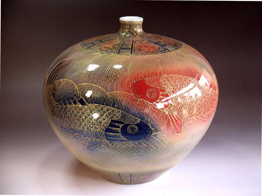 Extraordinary extremely intricately hand-painted large contemporary Japanese decorative Imari porcelain vase. The stunning palette of colors showcases hues of brilliant red, cobalt blue and gold on a striking ovoid body. In 2016, the British Museum