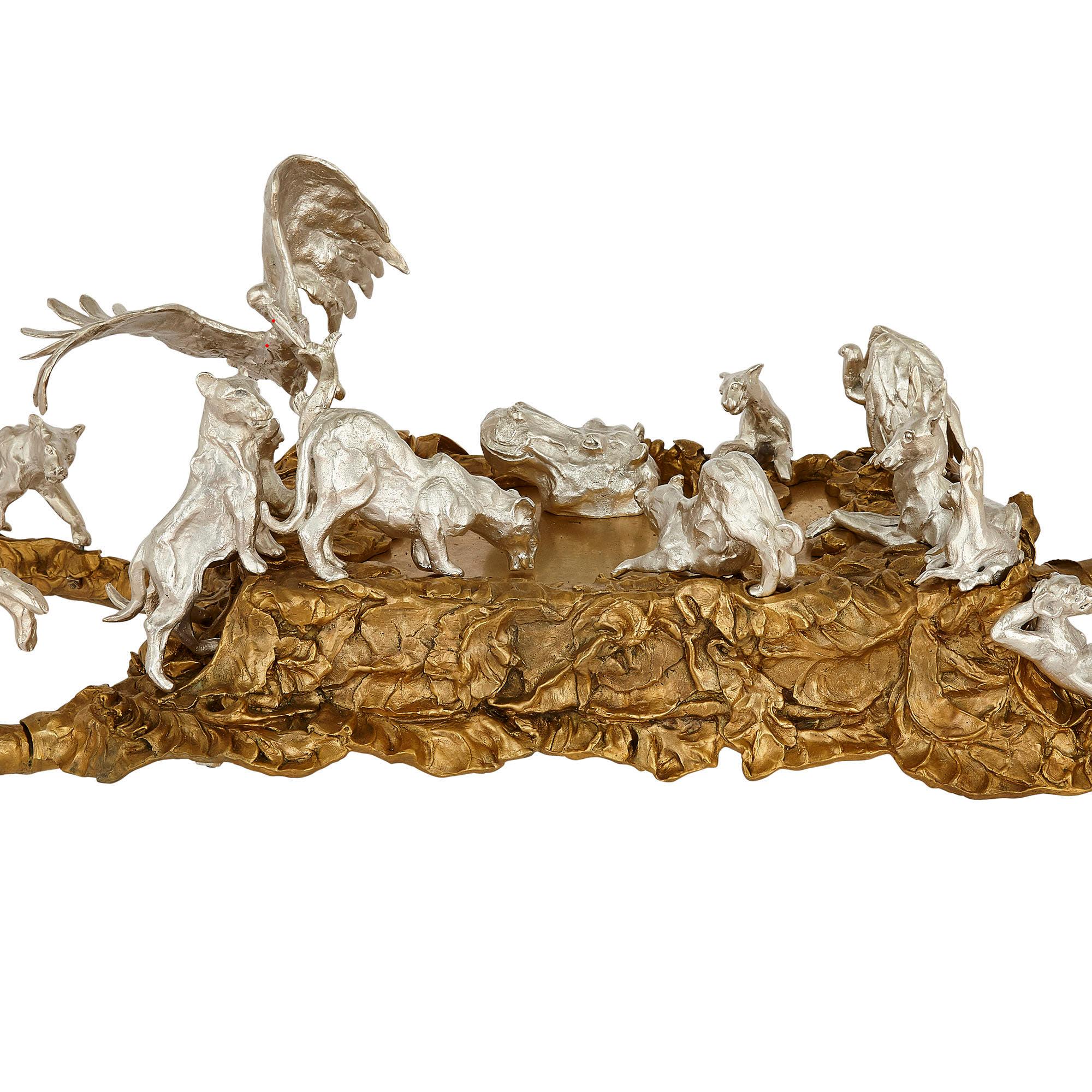 Contemporary gilt and silvered bronze animalier coffee table
Continental, 21st Century
Height 58cm, width 160cm, depth 80cm

This wonderful coffee table is after an example of JM David, an important French sculptor who died in 2015. The table is