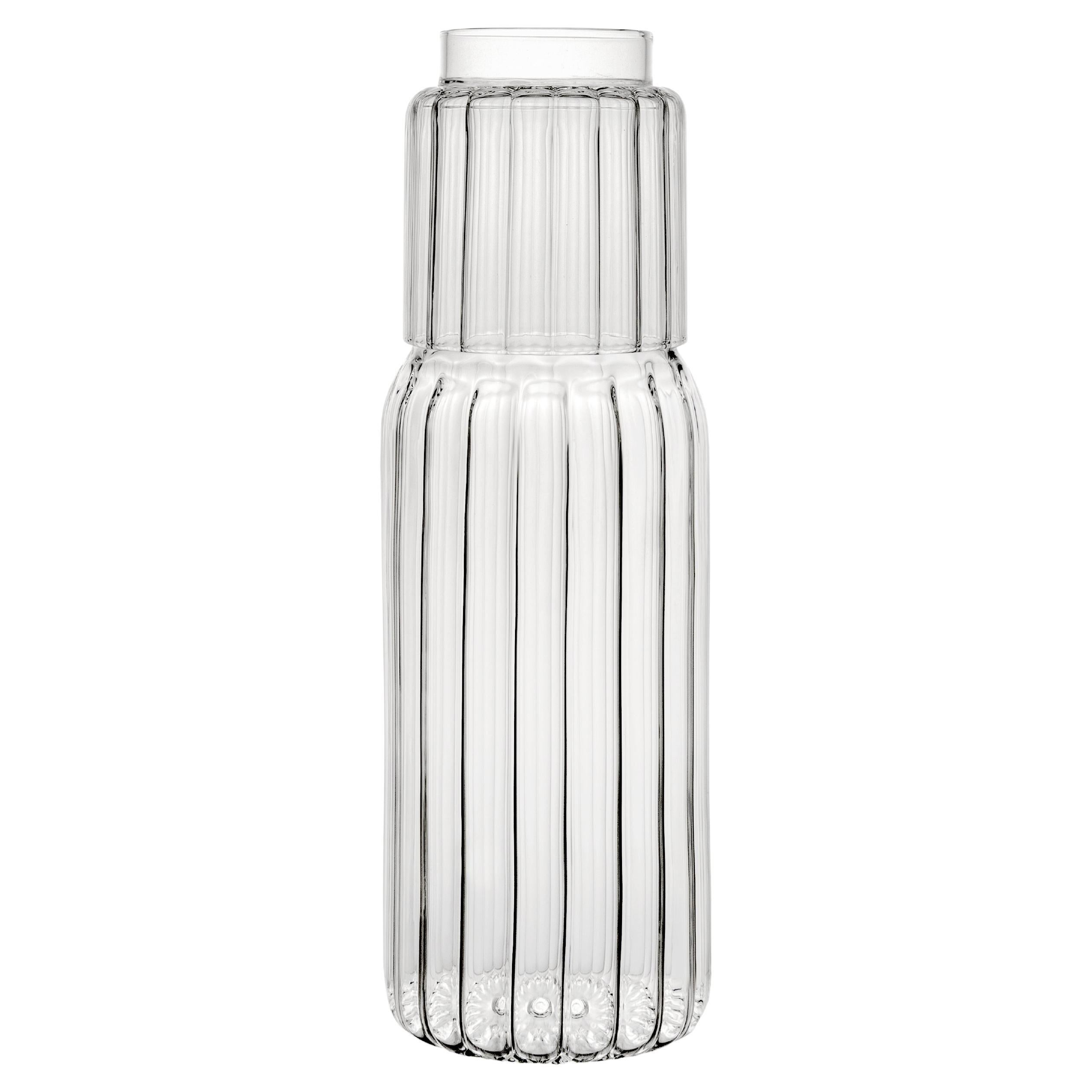 The linear form of the PILLAR carafe is inspired by architecture, and characterized by an understated yet imposing appeal.

A PILLAR tumbler glass is included in the set, serving as a lid for this versatile container that compliments the nightstand