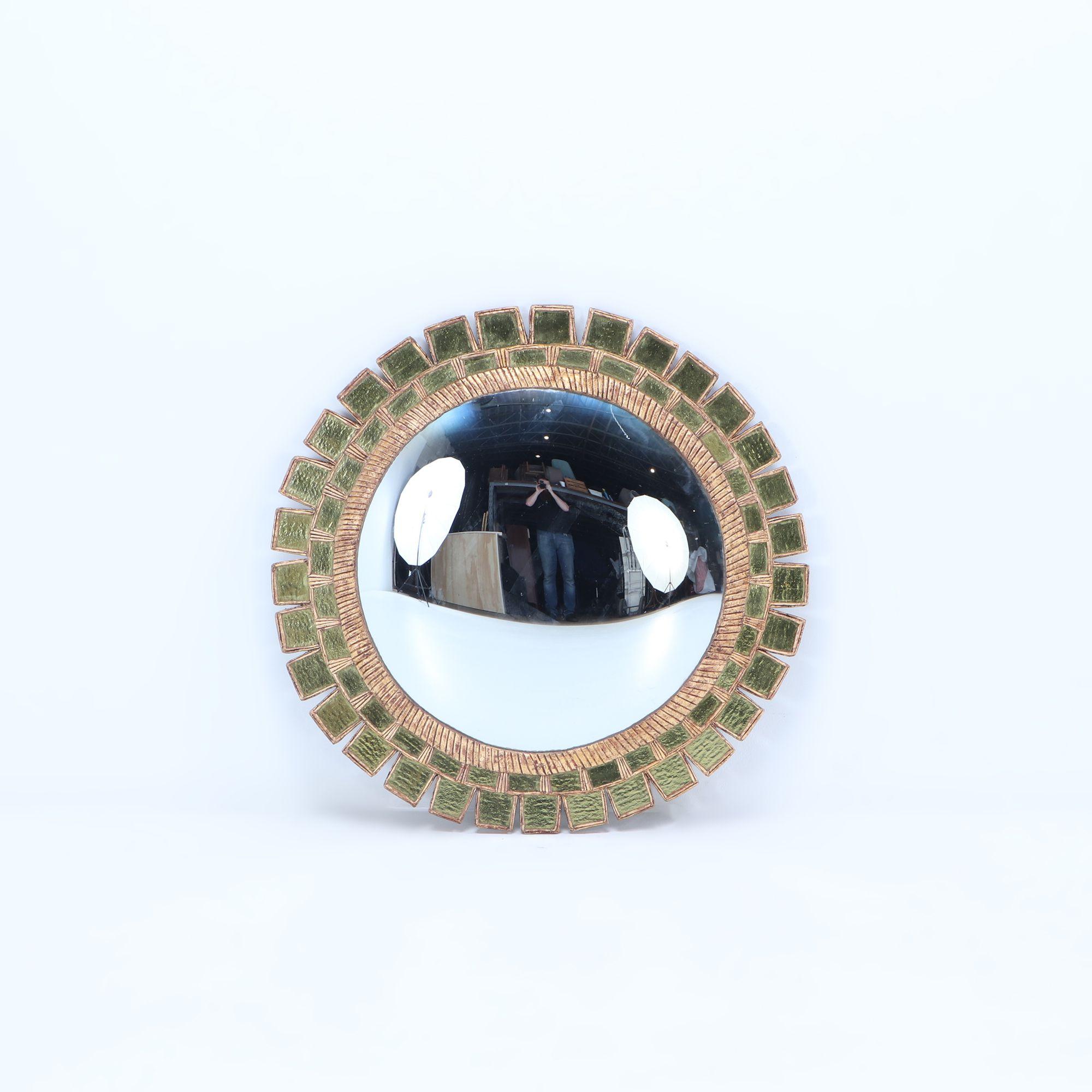 Contemporary glass and resin convex mirror in the manner of Line Vautrin having green textured glass and a geometric design. Possibly available in other sizes.