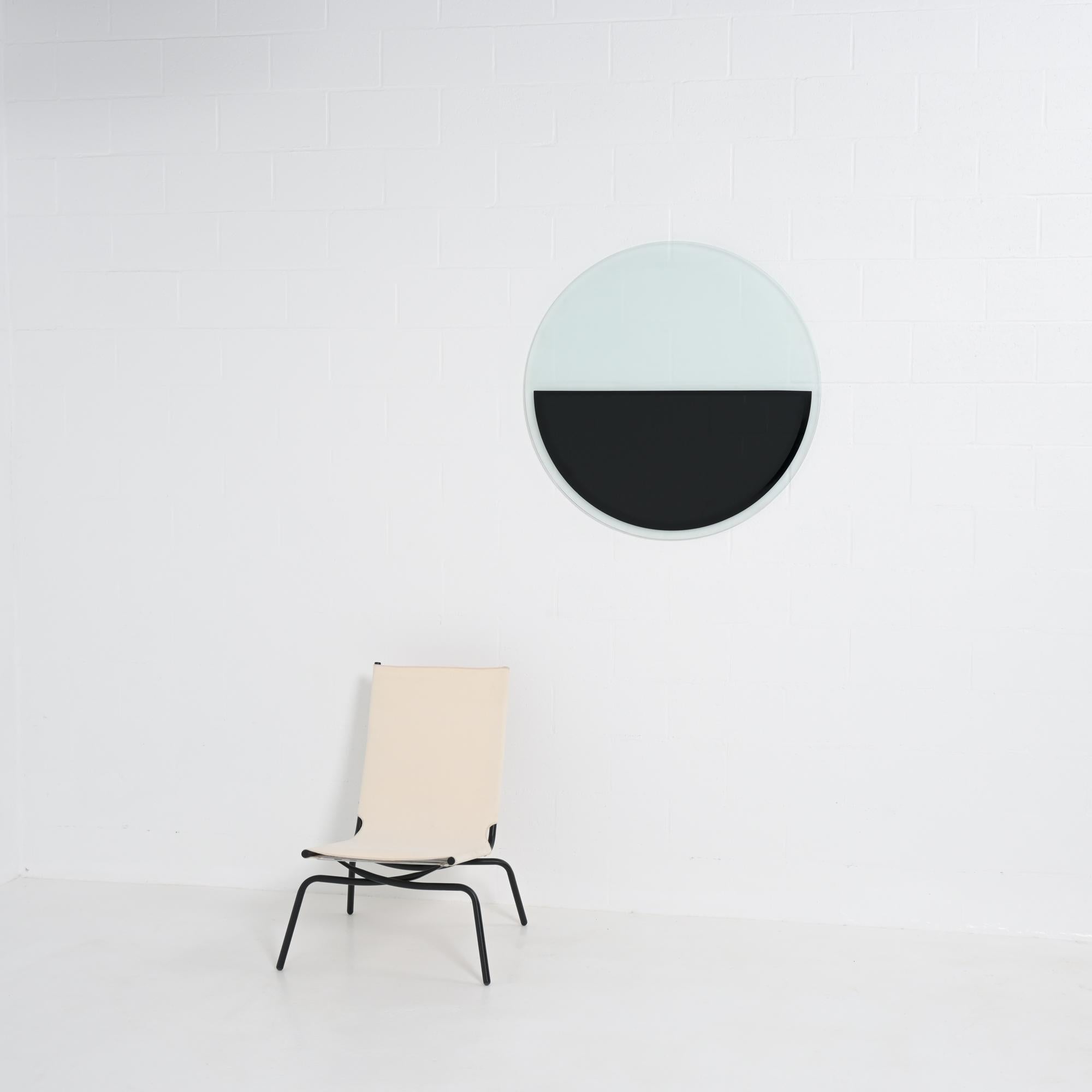 This wall-mountable artwork dates back to 2002.

The facets around the edges have been honed, the frosted glass is slightly translucent.

It is in good condition and marked