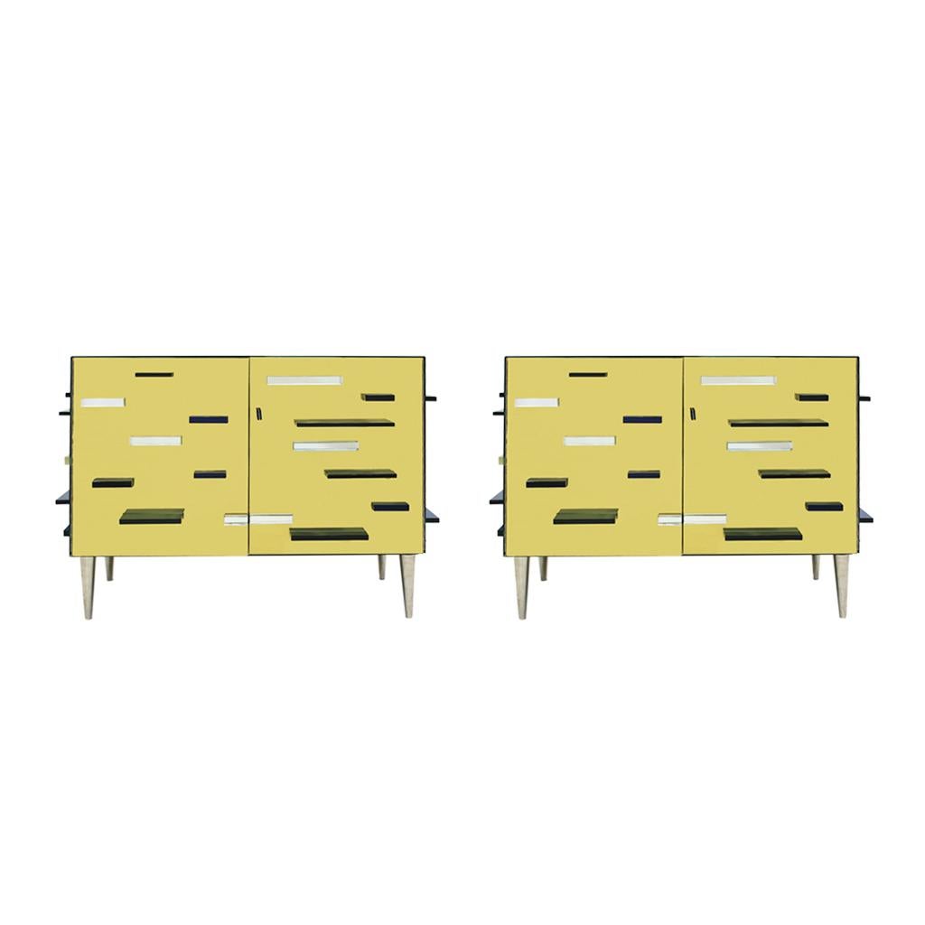 A wonderful and very elegant contemporary pair of Italian cabinets. Structure made of solid wood covered in mirror and gold glass with navy blue Murano glass decorative pieces, playing a geometric movement on the surface. One wooden shelve inside