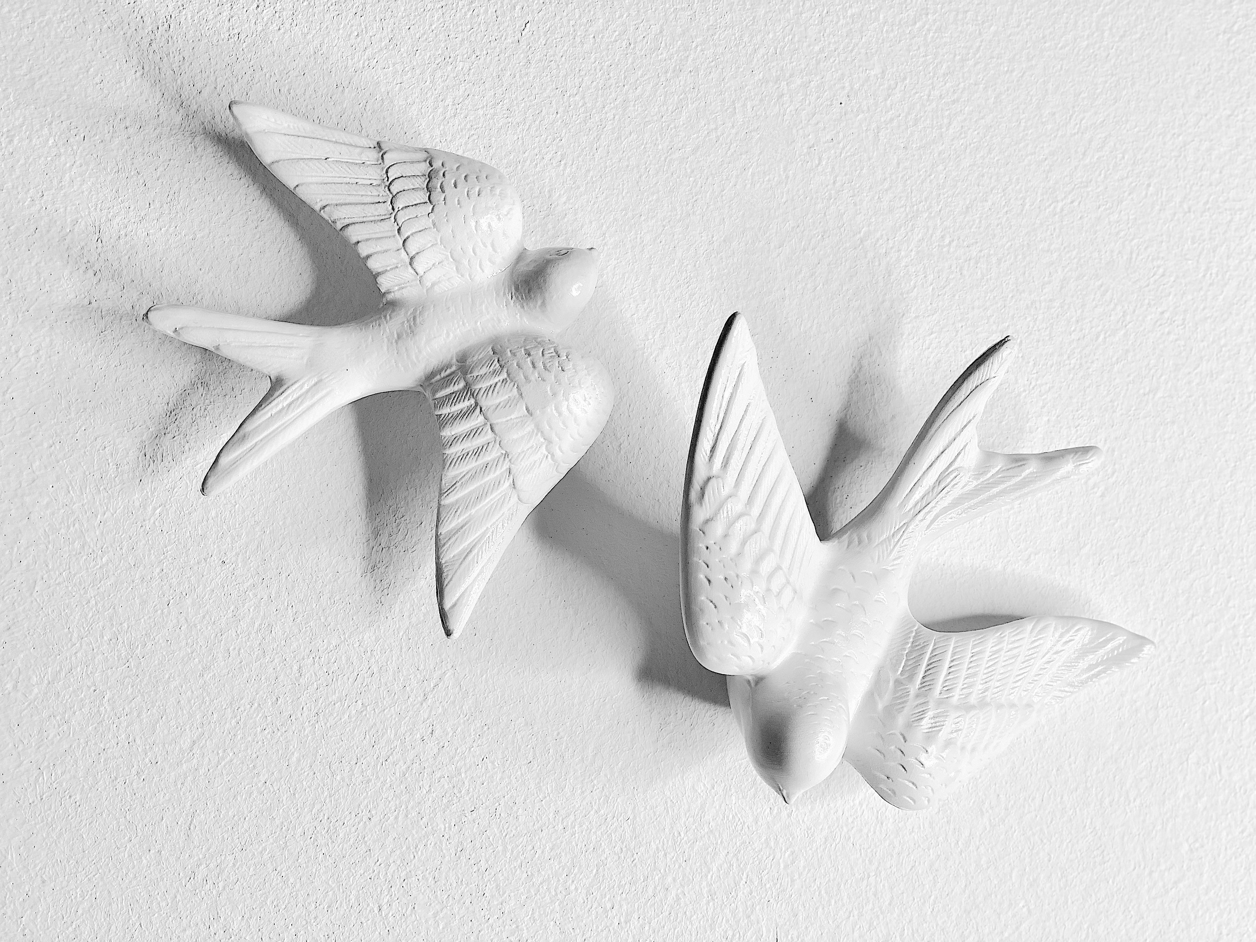 SWALLOWS Wall Ornament
Designed by Rodrigo Vairinhos

The SWALLOWS wall ornament set is a truly artistic and symbolic addition to any home. This unique set of 6 ceramic swallows—three measuring 13 cm and three at 14.5 cm—brings both elegance and