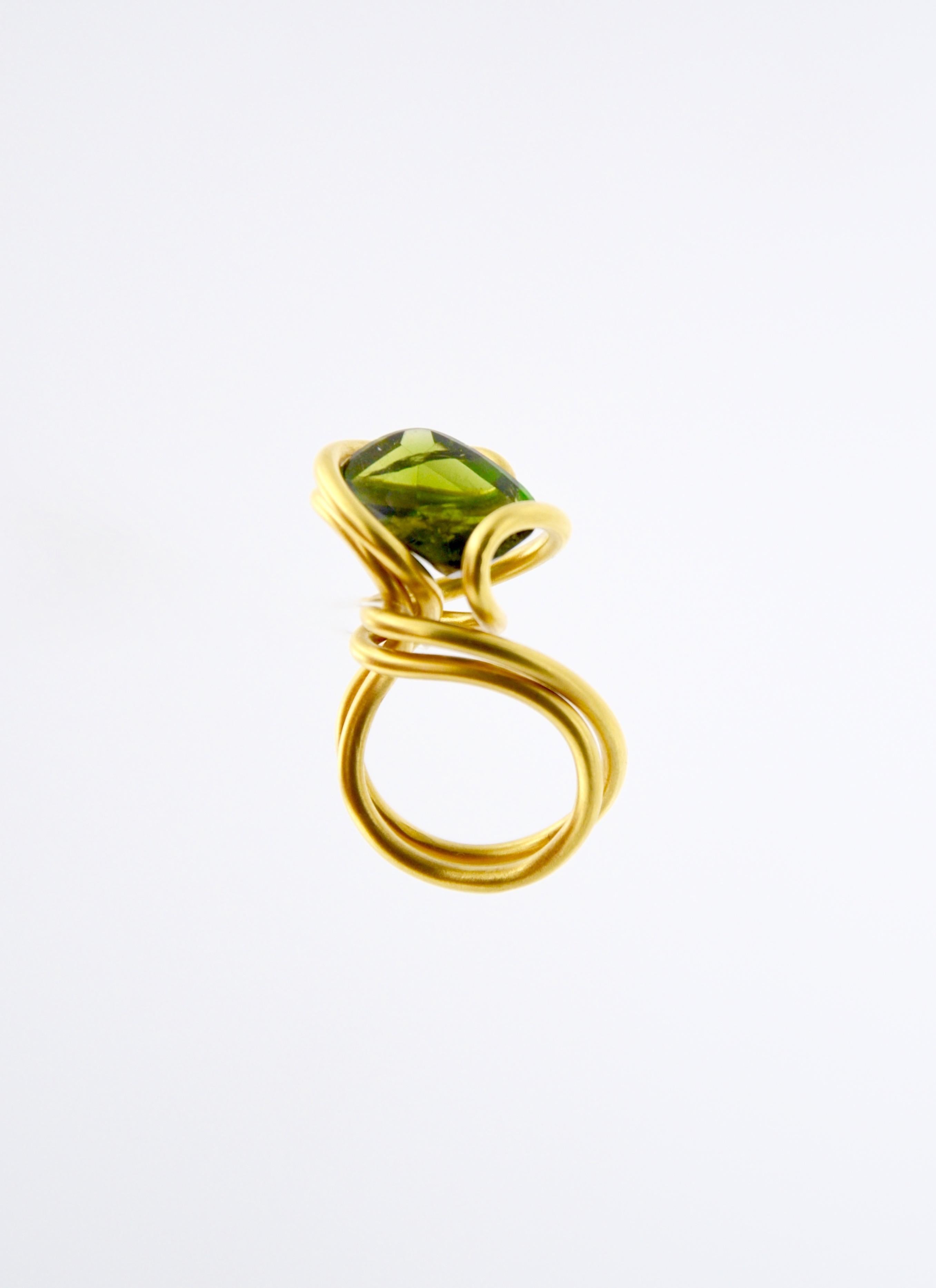 Contemporary Gold plated Silver rose Tourmaline  Cocktail Ring

Unique in its wavey, organic shape this golden ring holds a shiny rose tourmaline. 
Through light hitting the gemstone from 360 degrees it shines in all its brightness in a very intense