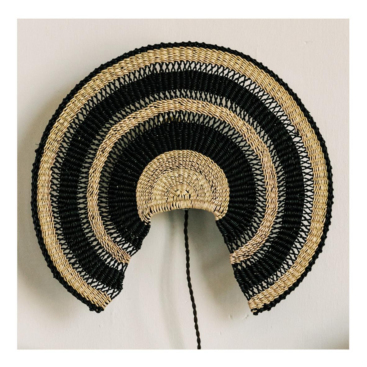 Wall lamp ADMIRADOR L: 
Seductive and effortless
Colour: Natural/Midnight (black),

Are you looking for a light that is also an ornament? Look no further with this large Wall Light based on a traditional fan. With it’s delicate weave it not only