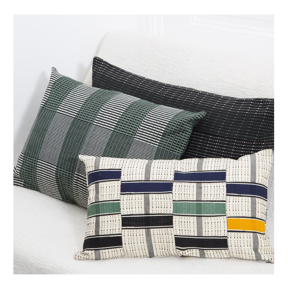 Woven Kente cushion 1-Step: 
Warm and delicate
Colours: Herb

Are you looking for hand crafted textur? This subtly graphic hand-woven cushion in Green, Black and Off-White has delicately striped pattern, that is contemporary. This XL cotton