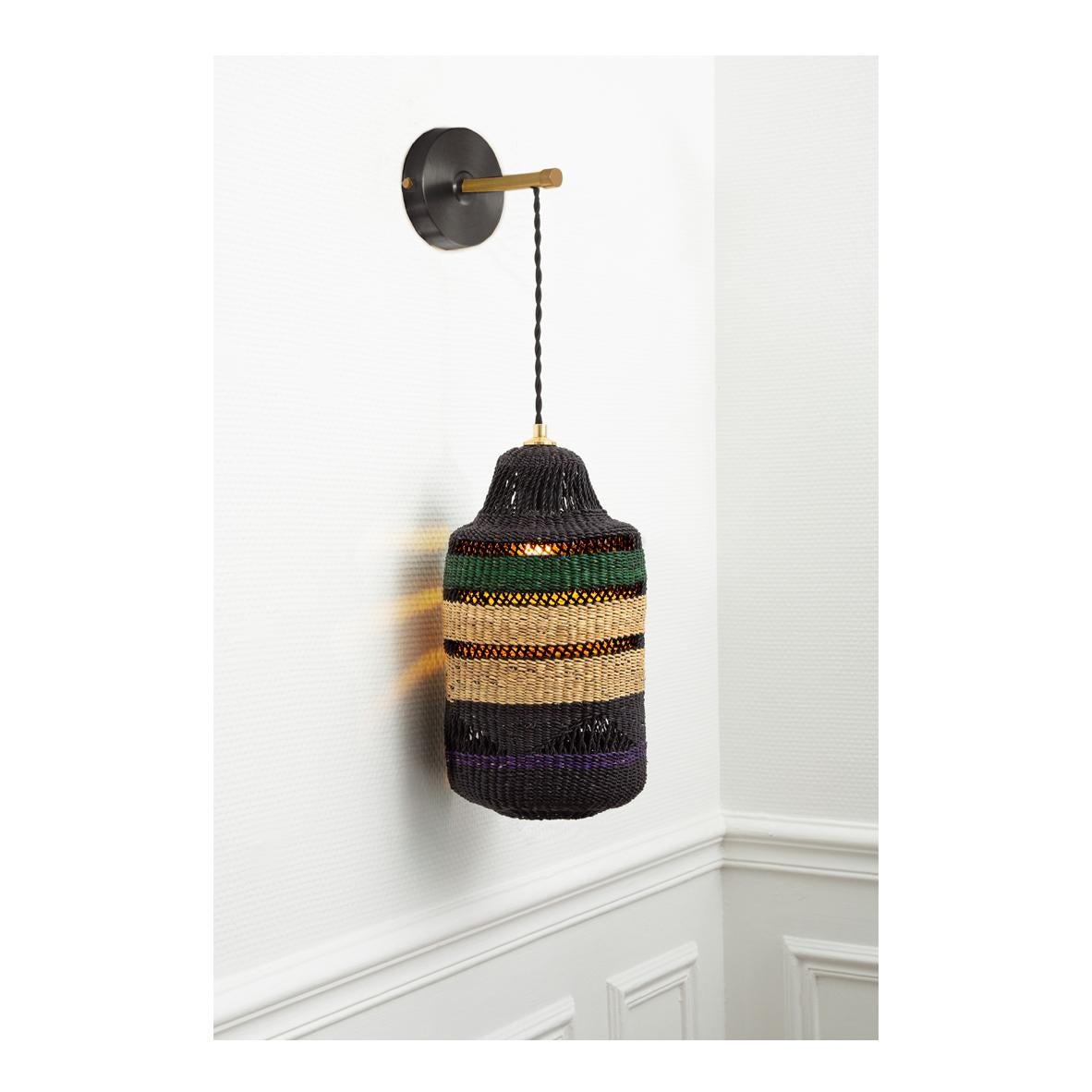 Wall lamp shadow : 
Gracefully woven 
Colour: Herb (bottle green) / Violet

Are you seeking an elegant surprise in your home? This pendant wall lantern can fill your room with mysterious patterns and light it has a lace like structure punctuated