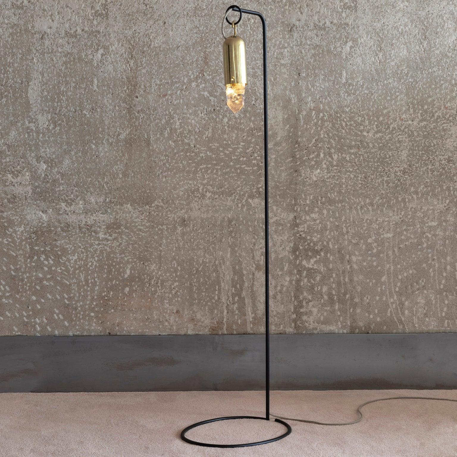 Contemporary golden floor lamp, in cast brass and Illuminated Raw Crystal.
Produced in São Paulo, Brazil.

This golden floor lamp was meticulously handmade by master artisans one delicate piece at a time. It is therefore quite difficult, if not